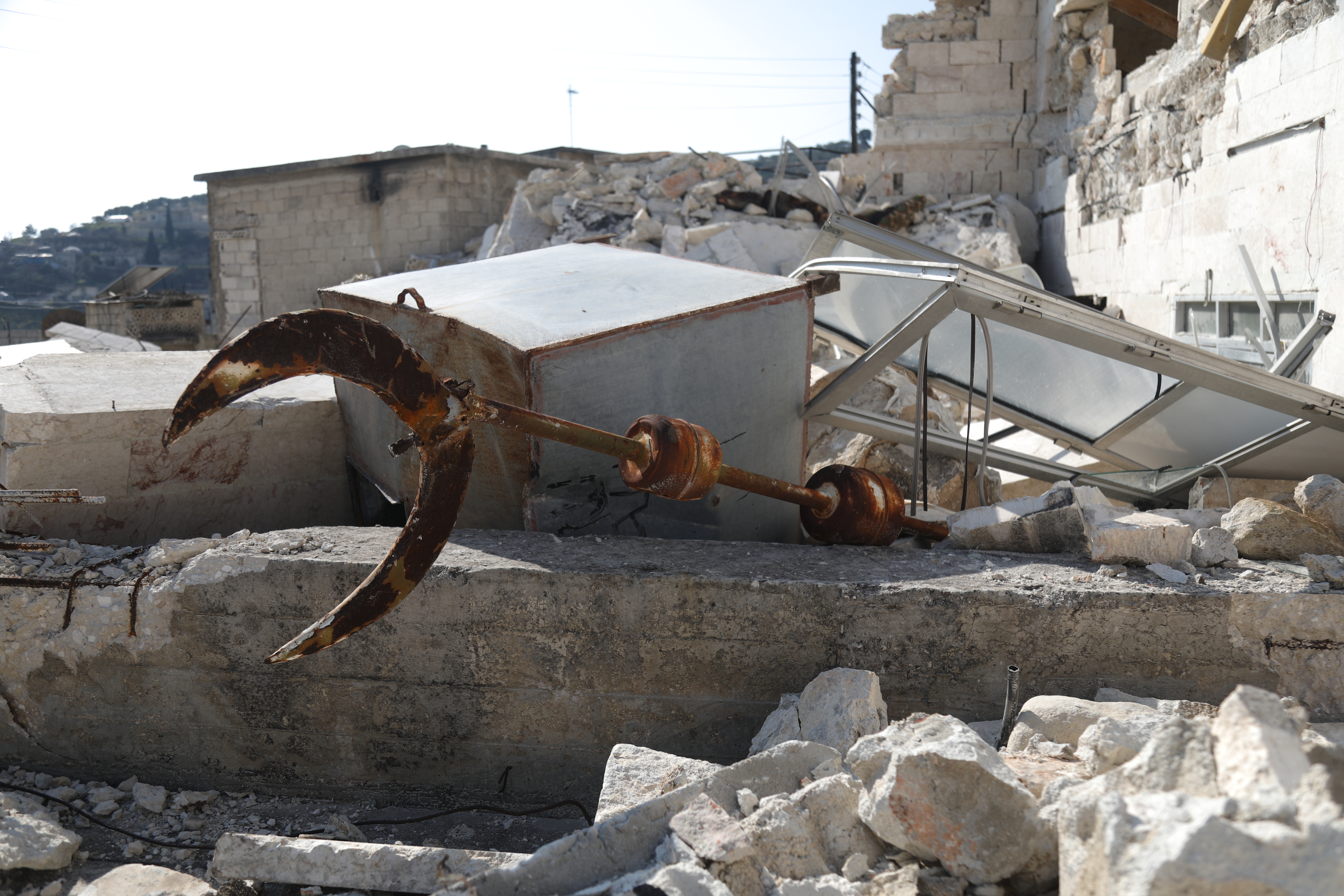 The fallen dome's finial is seen under parts of the fallen mosque