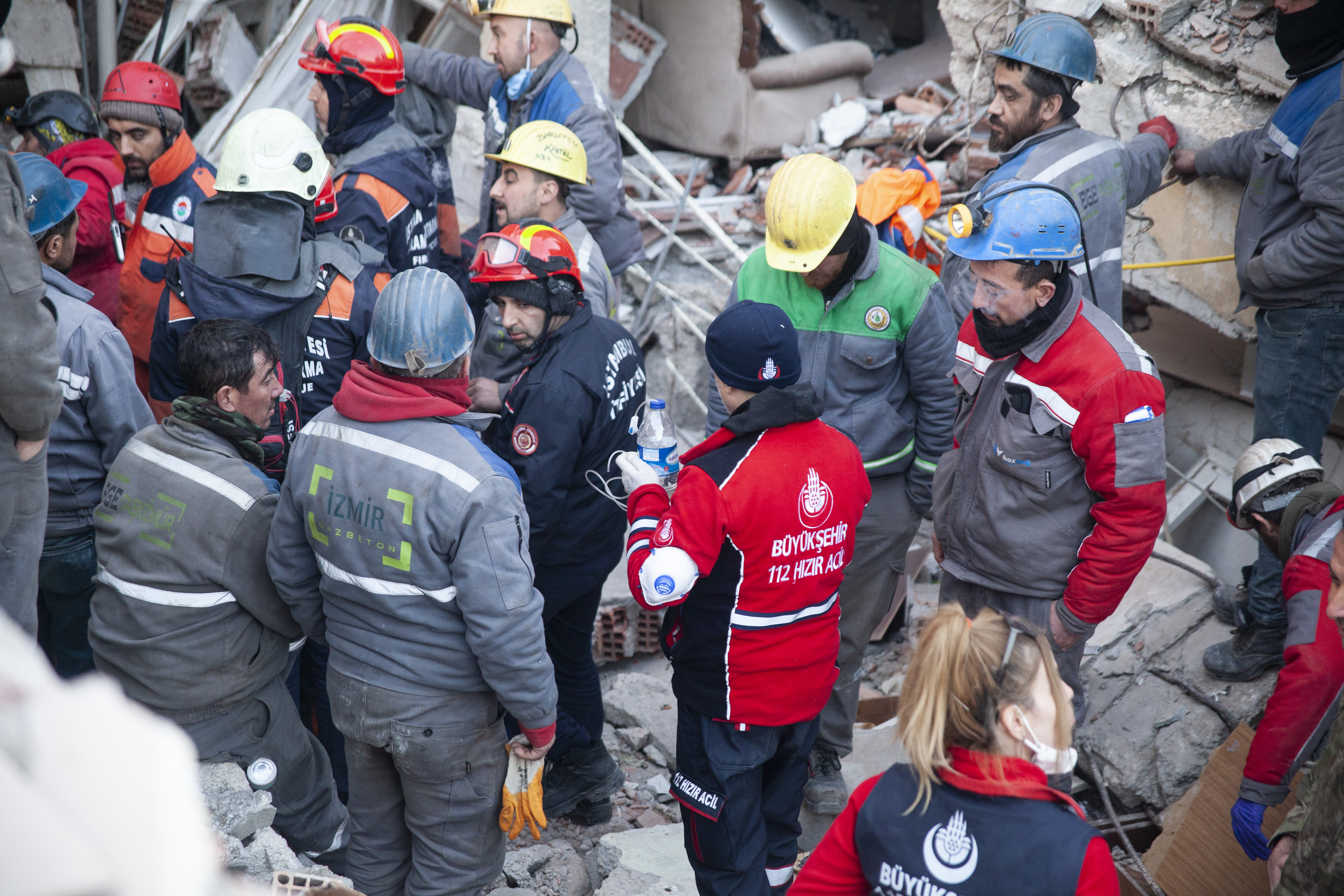 Water, and possibly liquid painkillers, are delivered to the young girl who is still alive after being trapped for nearly seven whole days since the earthquake