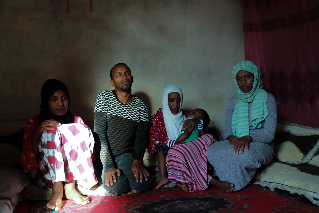 A family photo with a total of five people. From left to right- Halima Bati, Seid Anbesu, Jemila Muhammad, Reyan Seid, and Aziza Shemsedin .