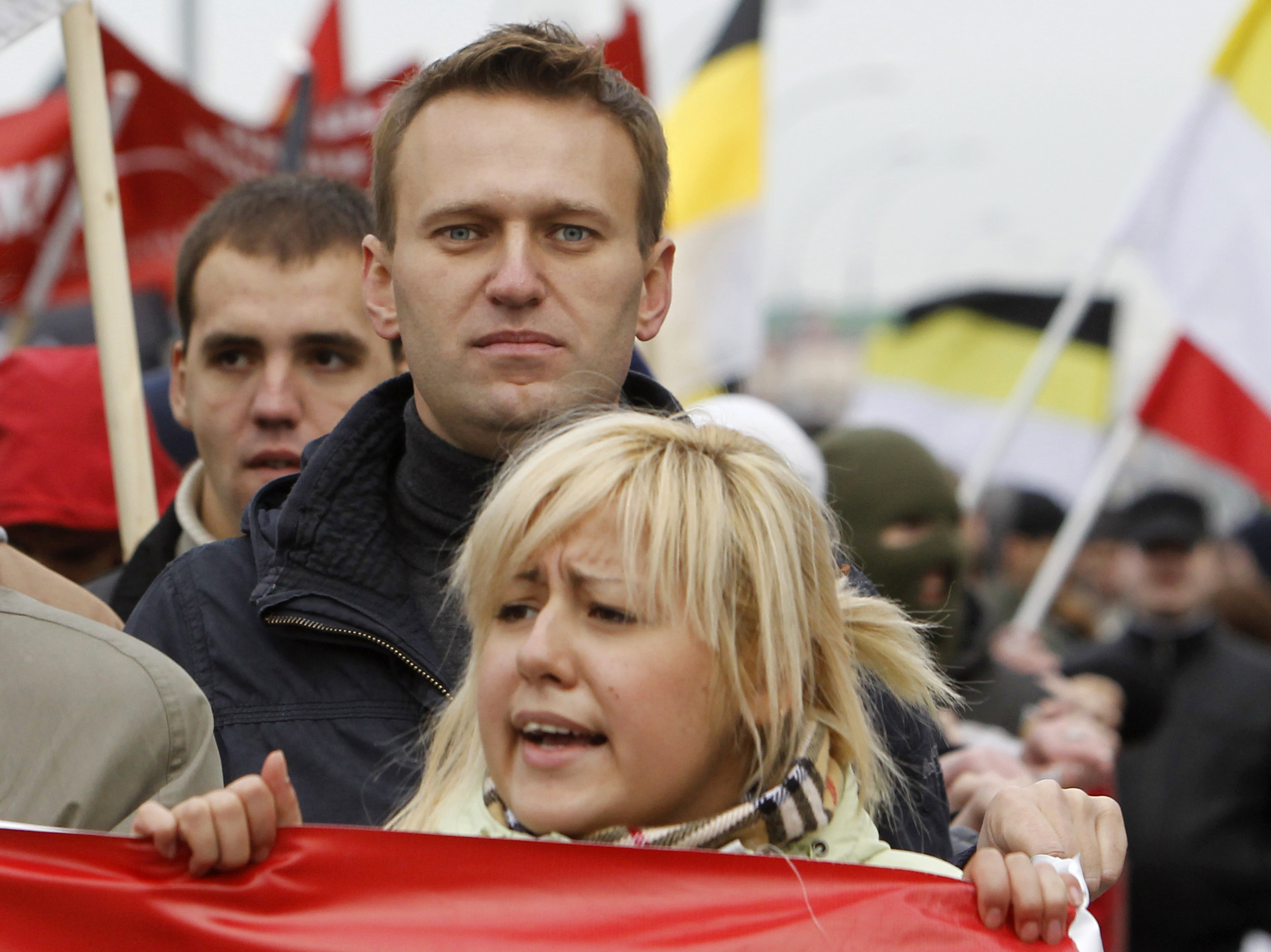 Russian lawyer and blogger Alexei Navalny (C, 2nd row) takes part in the so-called "Russian March" demonstration on the National Unity Day in the capital Moscow, November 4, 2011. Russia marks the National Unity Day on November 4 when it celebrates the defeat of Polish invaders in 1612 and replaces a communist celebration of the 1917 revolution. REUTERS/Denis Sinyakov (RUSSIA - Tags: ANNIVERSARY SOCIETY)
