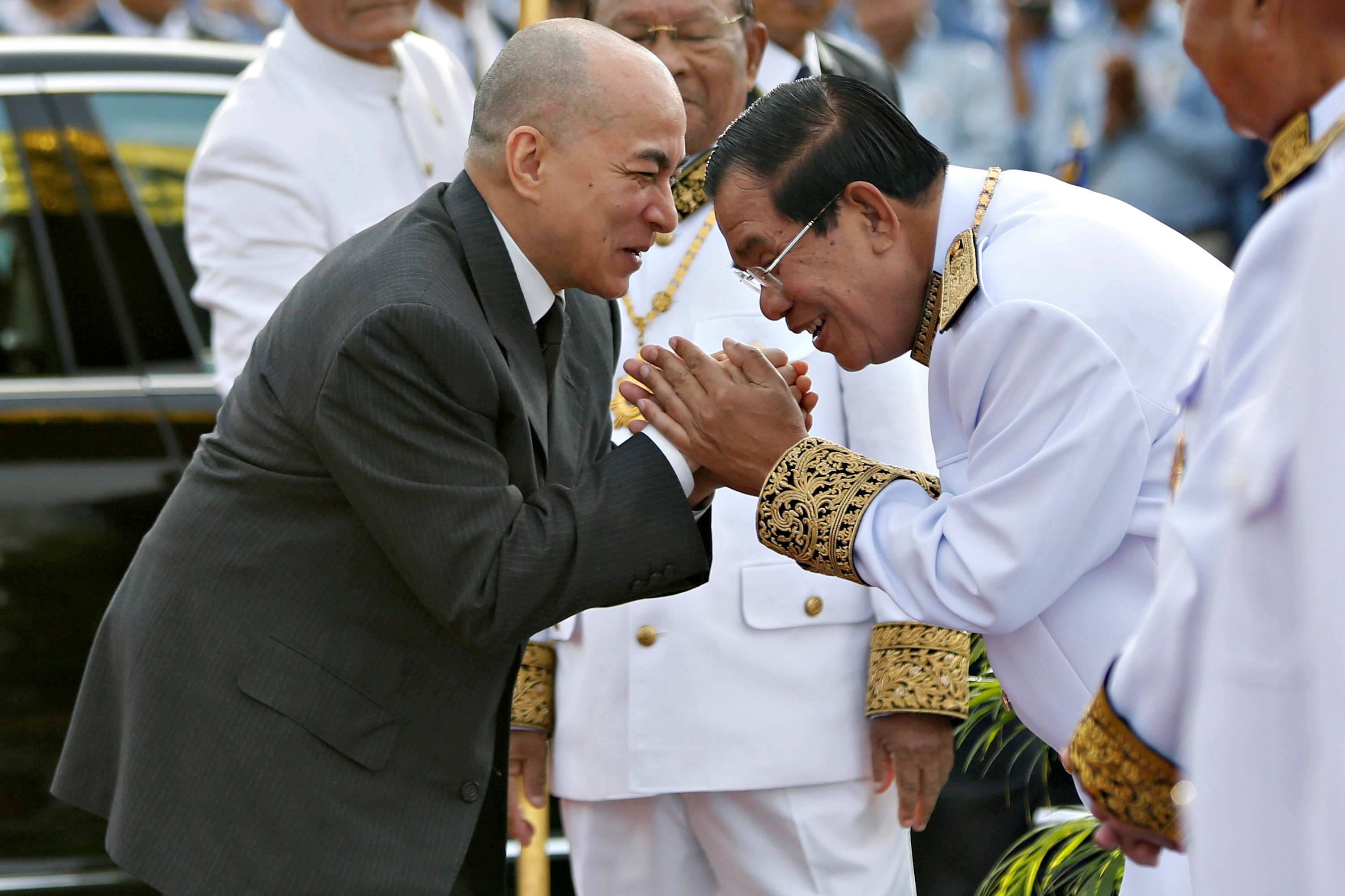 Cambodia's King Norodom Sihamoni is greeted by prime minister Hun Sen