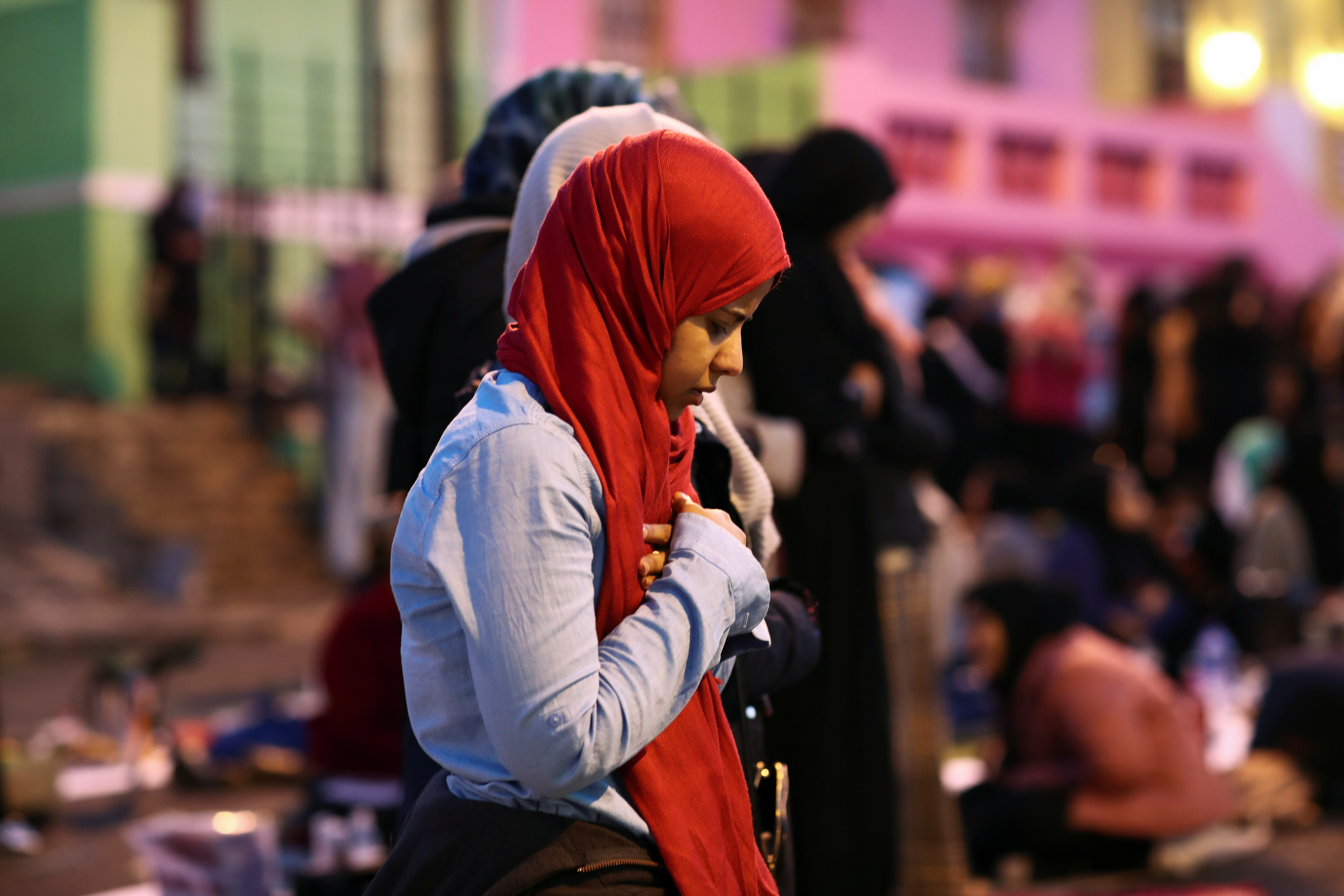 Muslim women perform Maghrib prayer after a mass Iftar (breaking of the fast) during the holy month of Ramadan in Bo-Kaap, Cape Town, South Africa, May 31, 2019. REUTERS/Sumaya Hisham