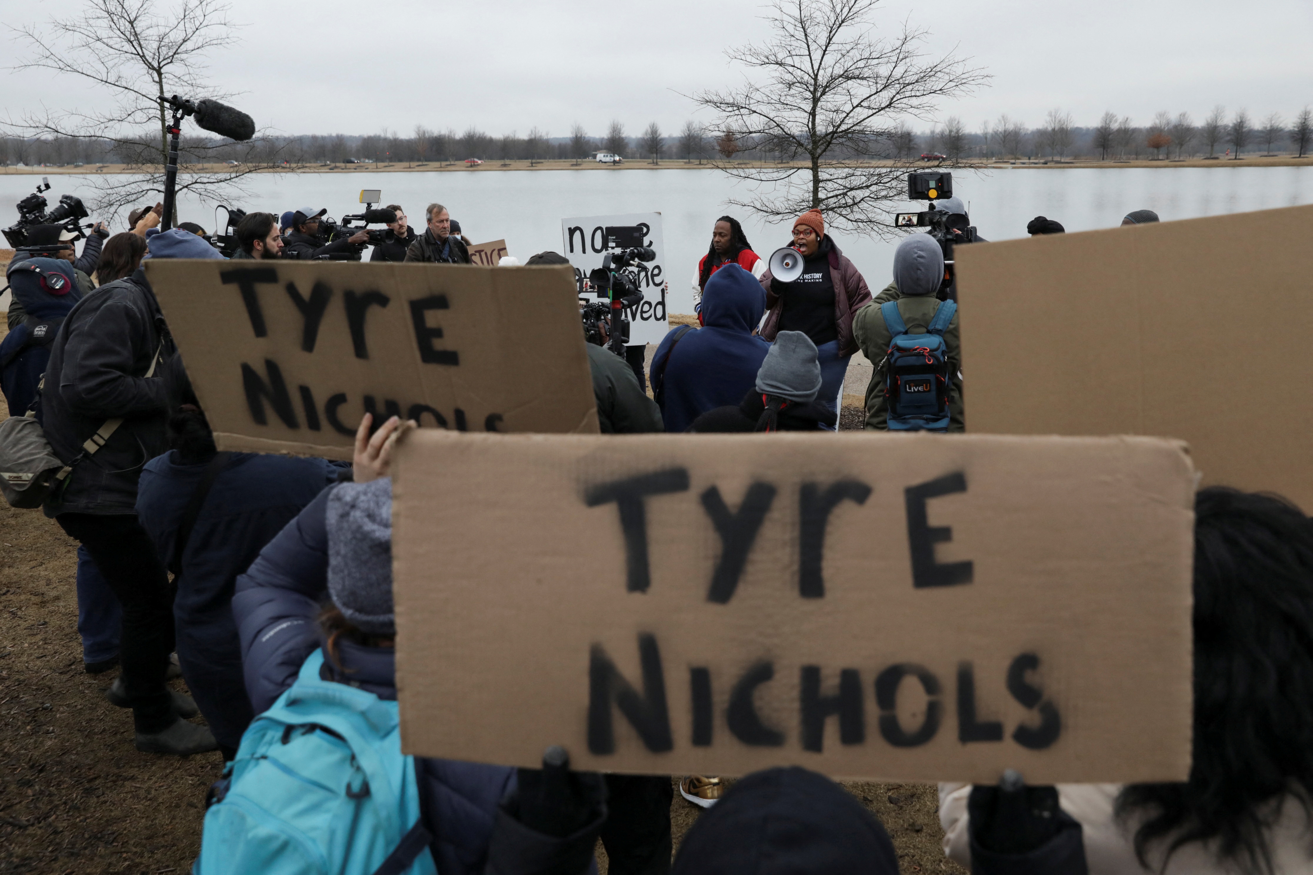 People hold placards during a protest after the death of Tyre Nichols, the Black man who was fatally beaten by Memphis police officers, in Memphis, Tennessee, U.S. January 30, 2023. REUTERS/Alyssa Pointer