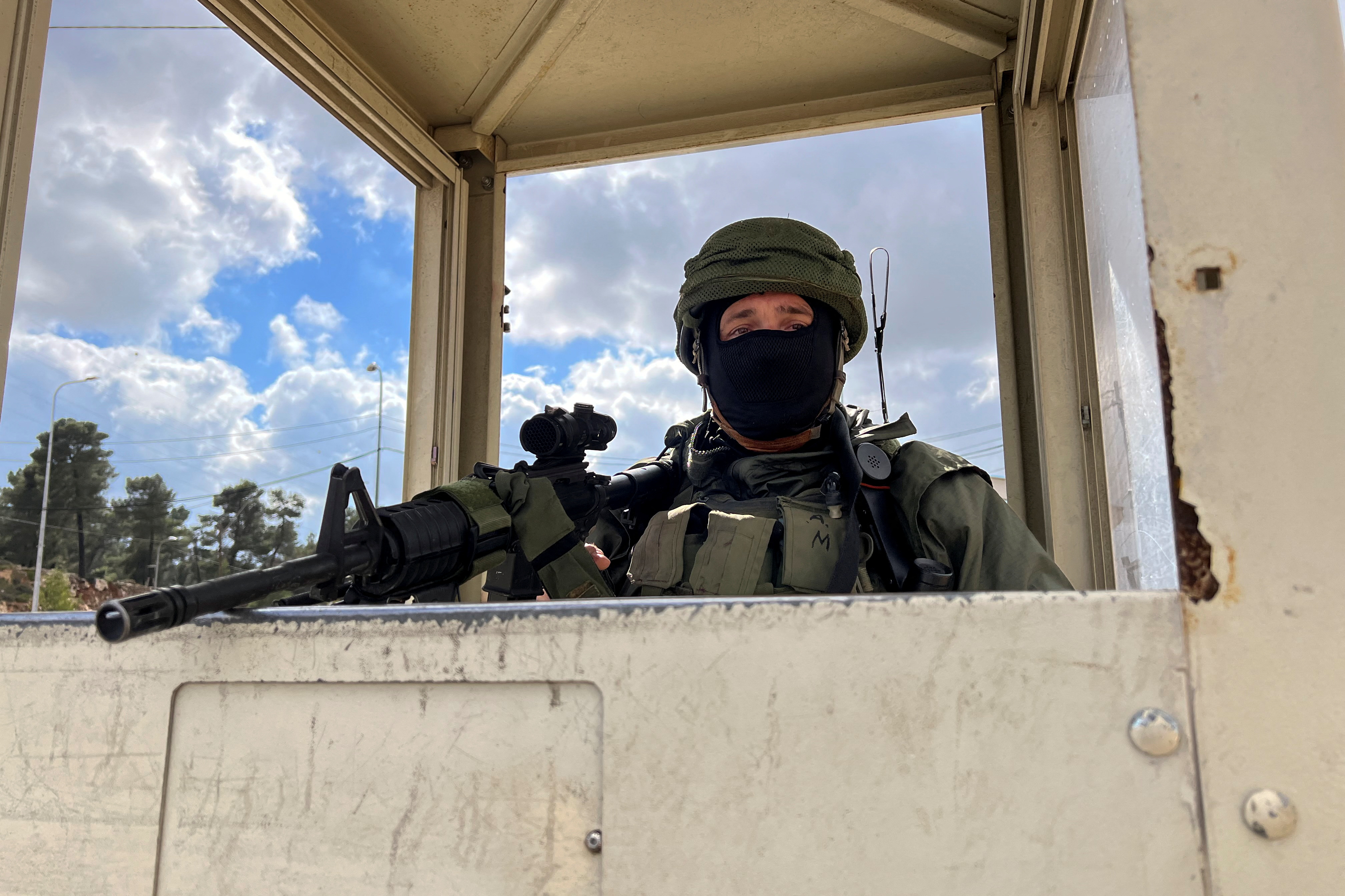 A soldier stands guard at Gush Etzion Junction in the Gush Etzion settlements compound, in the Israeli-occupied West Bank February 2, 2023. REUTERS/Dedi Hayun