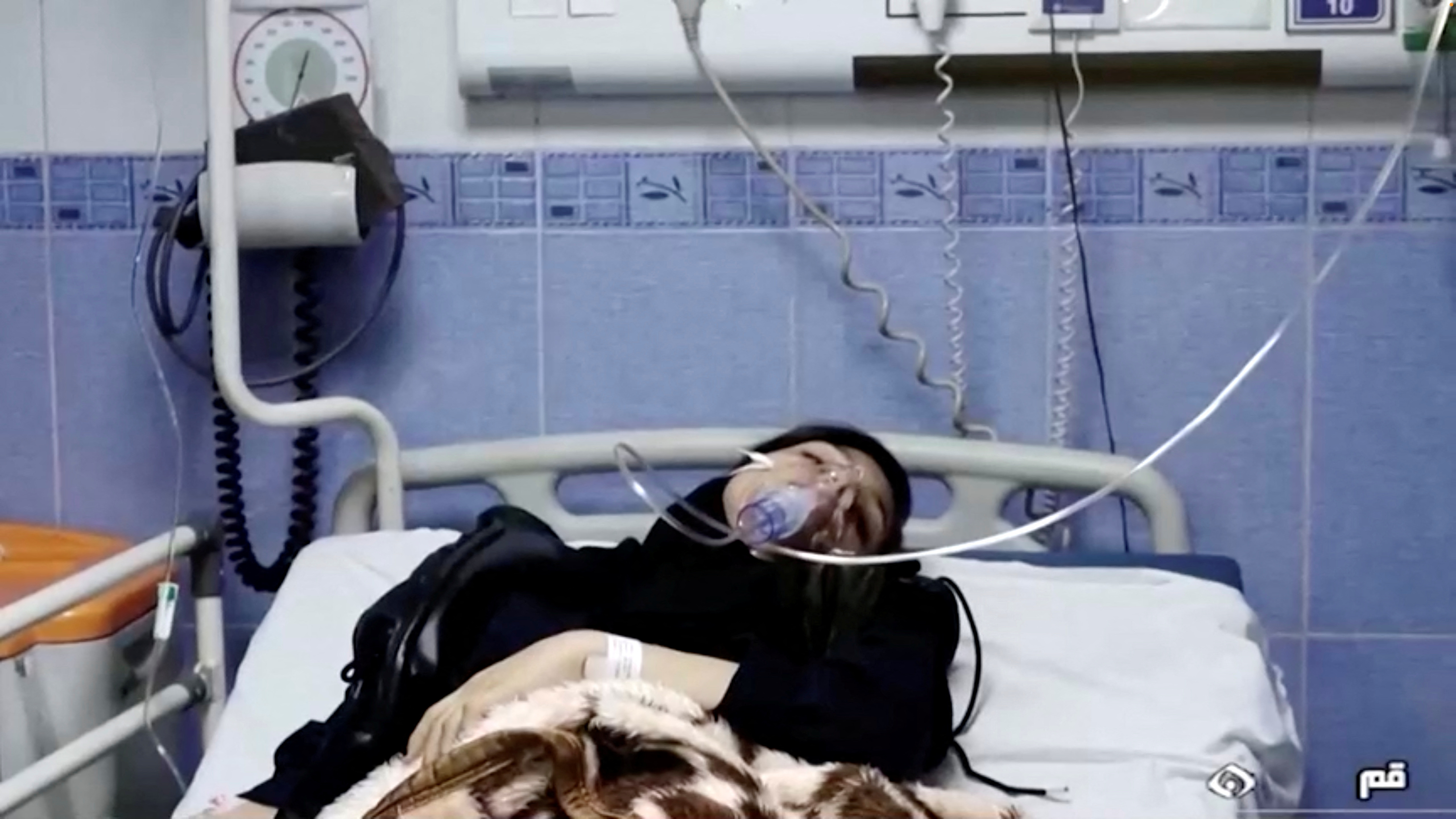 A young woman lies in hospital after reports of poisoning at an unspecified location in Iran in this still image from video from March 2, 2023. WANA/Reuters TV via REUTERS ATTENTION EDITORS - THIS IMAGE HAS BEEN SUPPLIED BY A THIRD PARTY. IRAN OUT. NO COMMERCIAL OR EDITORIAL SALES IN IRAN. No use BBC Persian. No use VOA Persian. No use Manoto. No use Iran International.