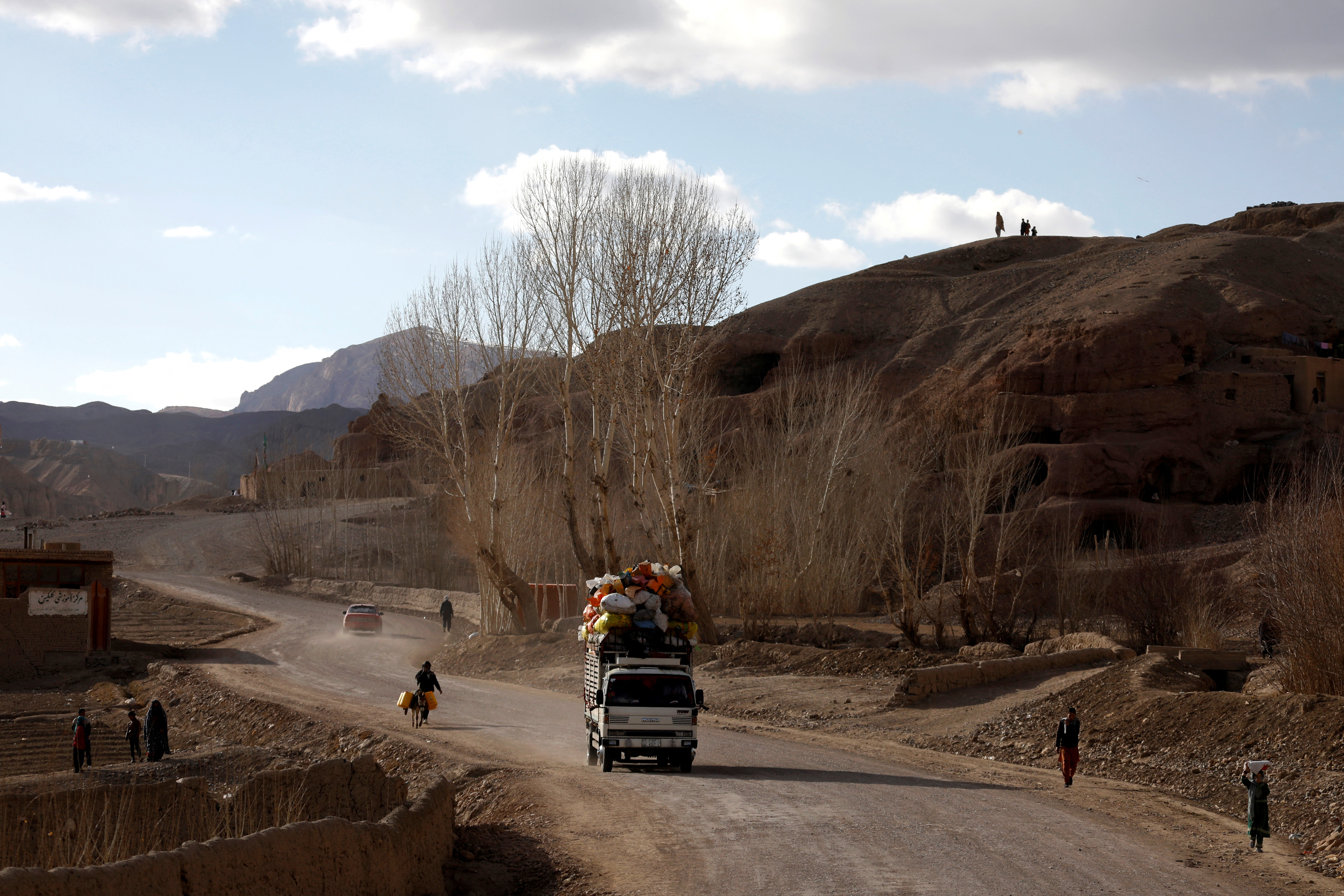 A vehicle drives along a road in Bamiyan, Afghanistan