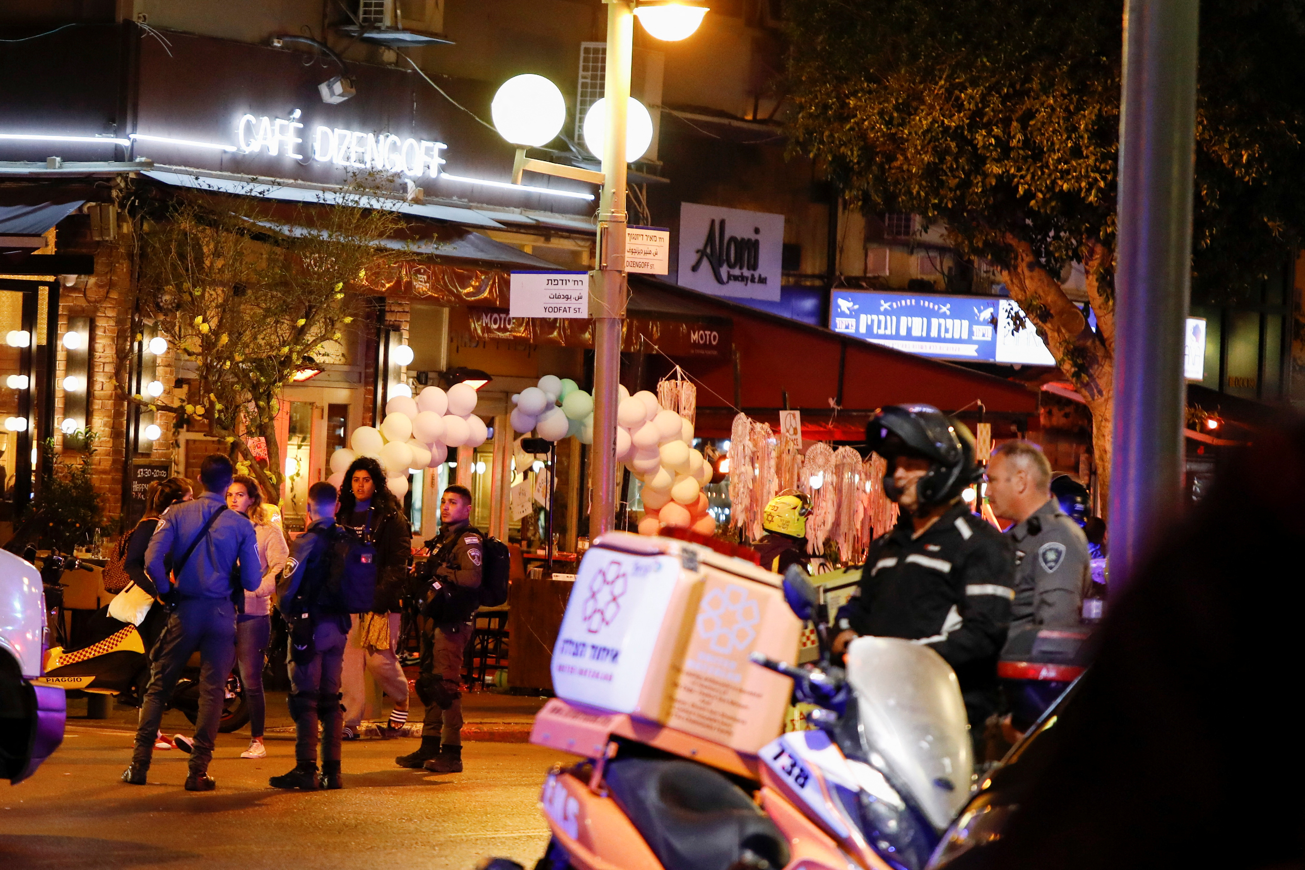 Israeli security personnel work at the scene of a suspected shooting attack in central Tel Aviv