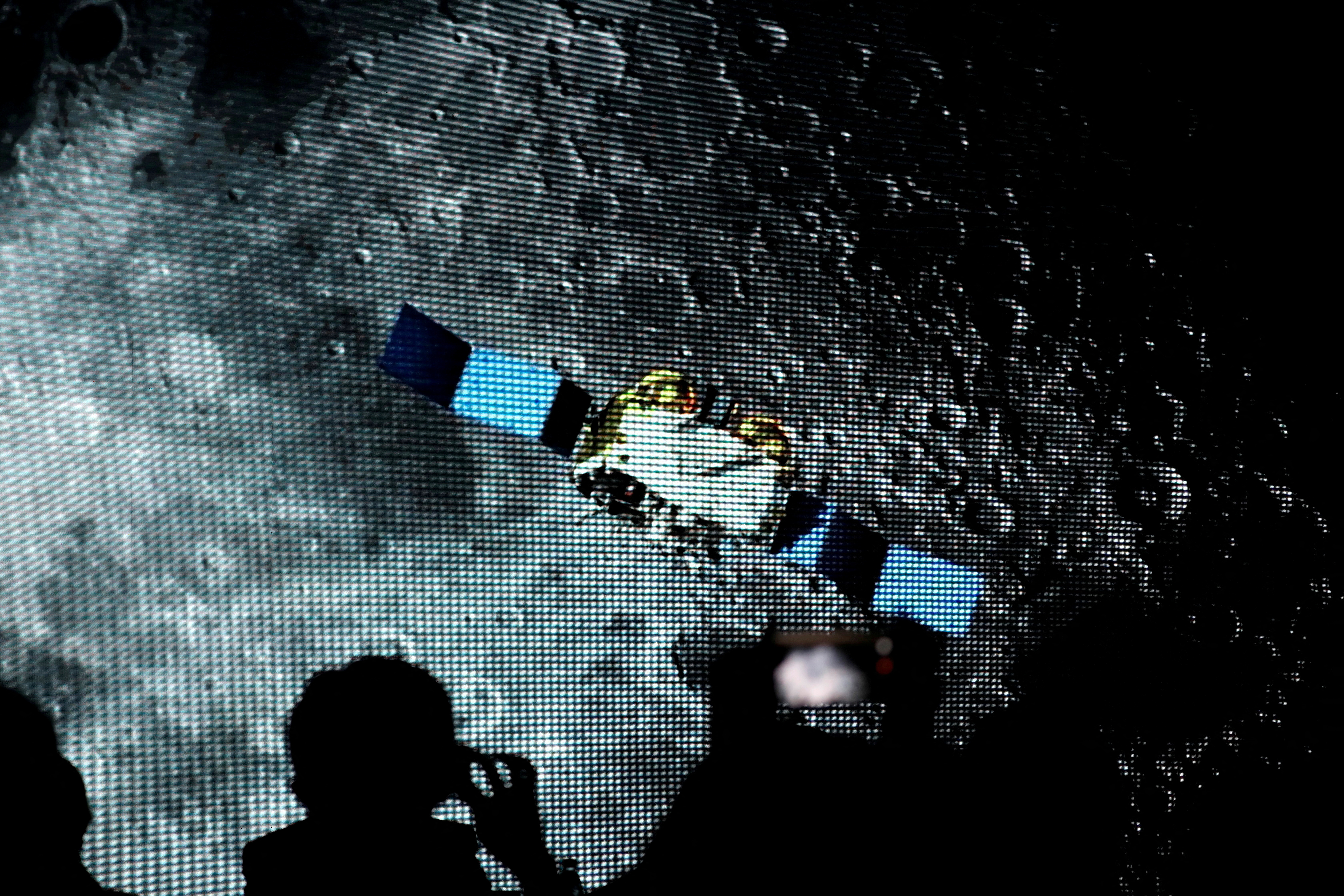 A screen shows footages of spacecraft for Chang'e-5 Mission.