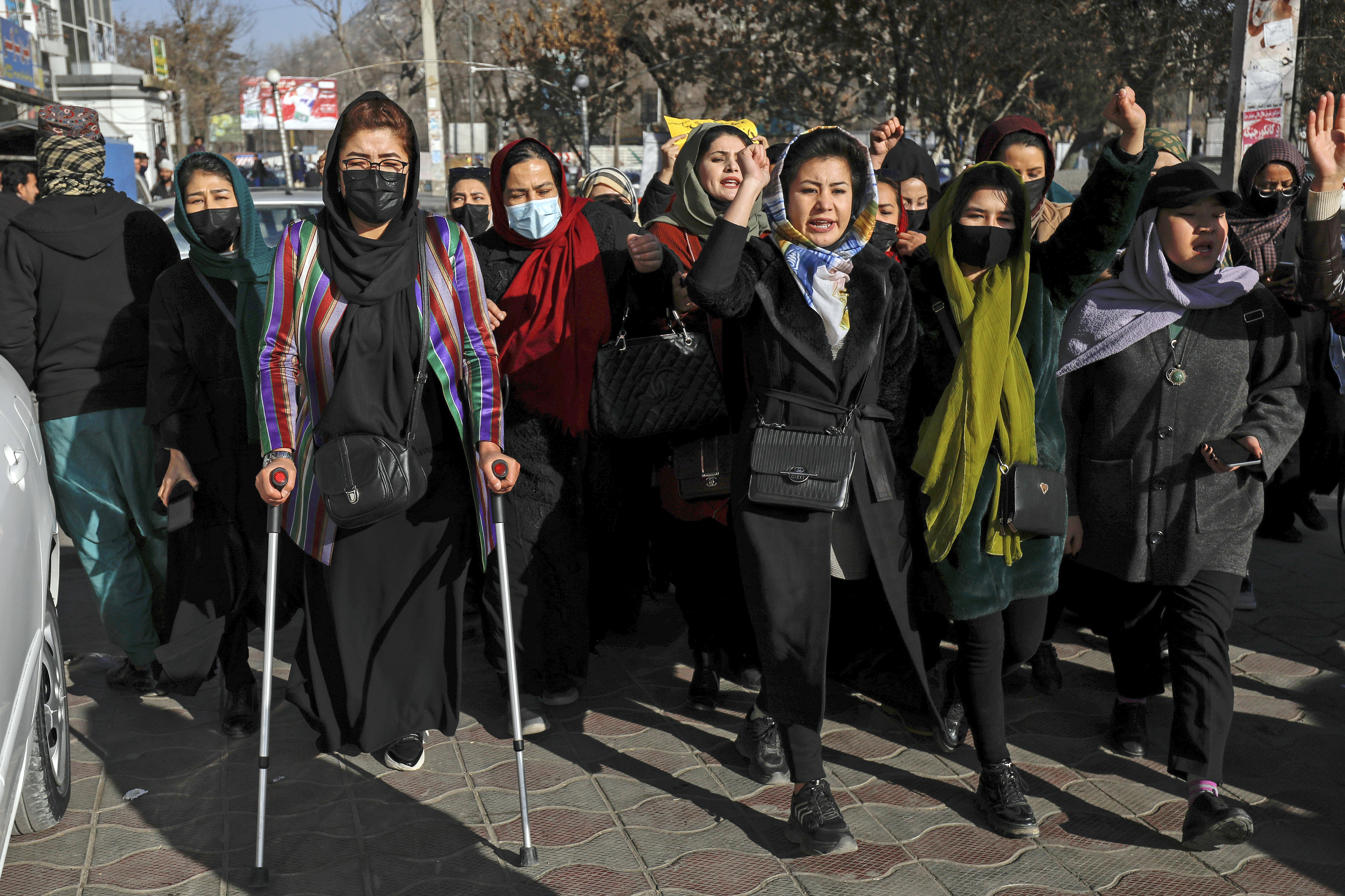 Afghan women chant slogans during a protest against the ban on university education for women, in Kabul, Afghanistan, December 22, 2022 [AP Photo]