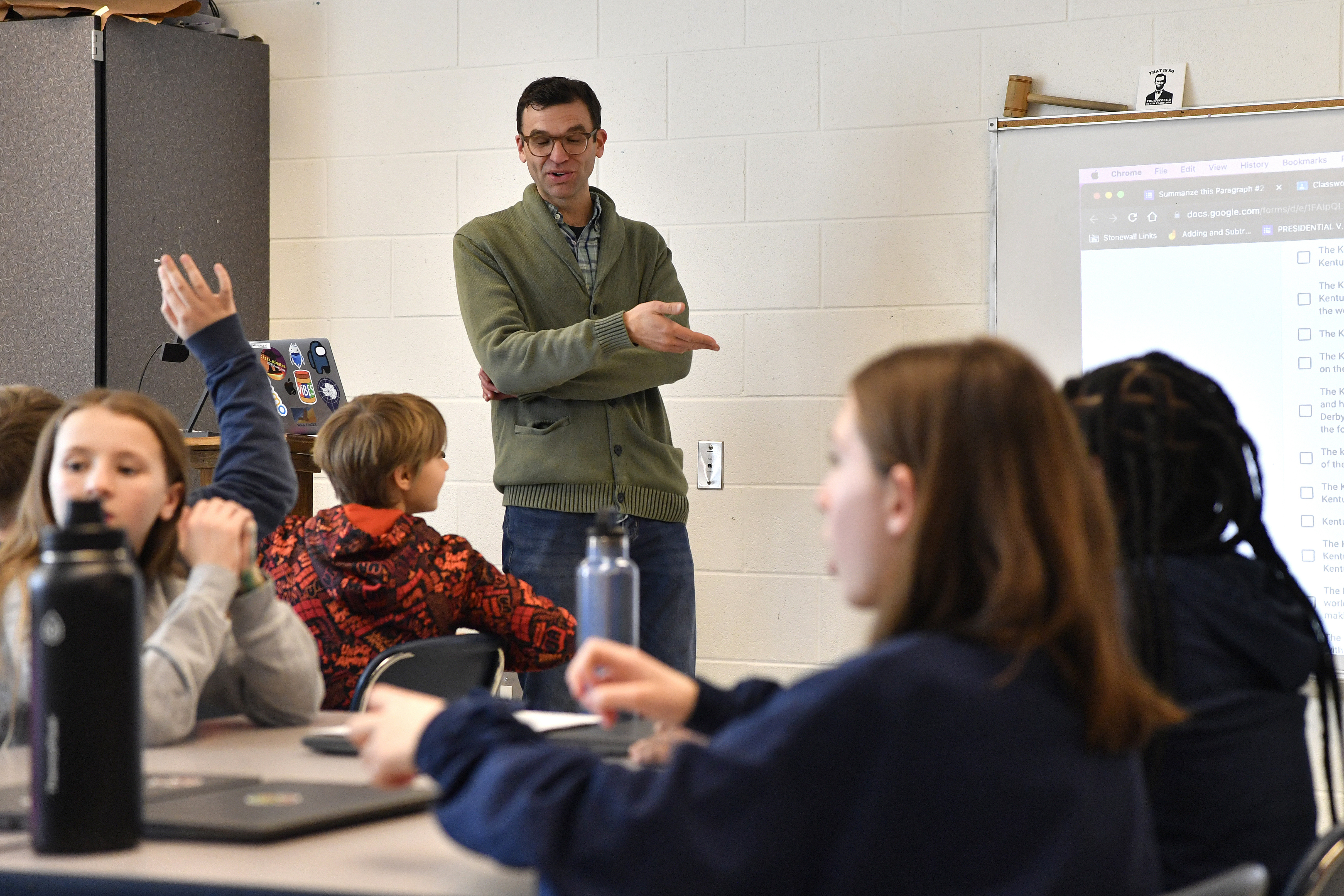 Teacher Donnie Piercey goes over the results of a writing assignment called "Find the Bot" during his class at Stonewall Elementary in Lexington, Kentucky. The students each summarized a text about boxing champion and Kentucky icon Muhammad Ali then tried to figure out which summaries were penned by classmates and which was written by the chatbot. The chatbot was the new artificial intelligence tool ChatGPT, which can generate everything from essays and haikus to term papers in a matter of seconds.
