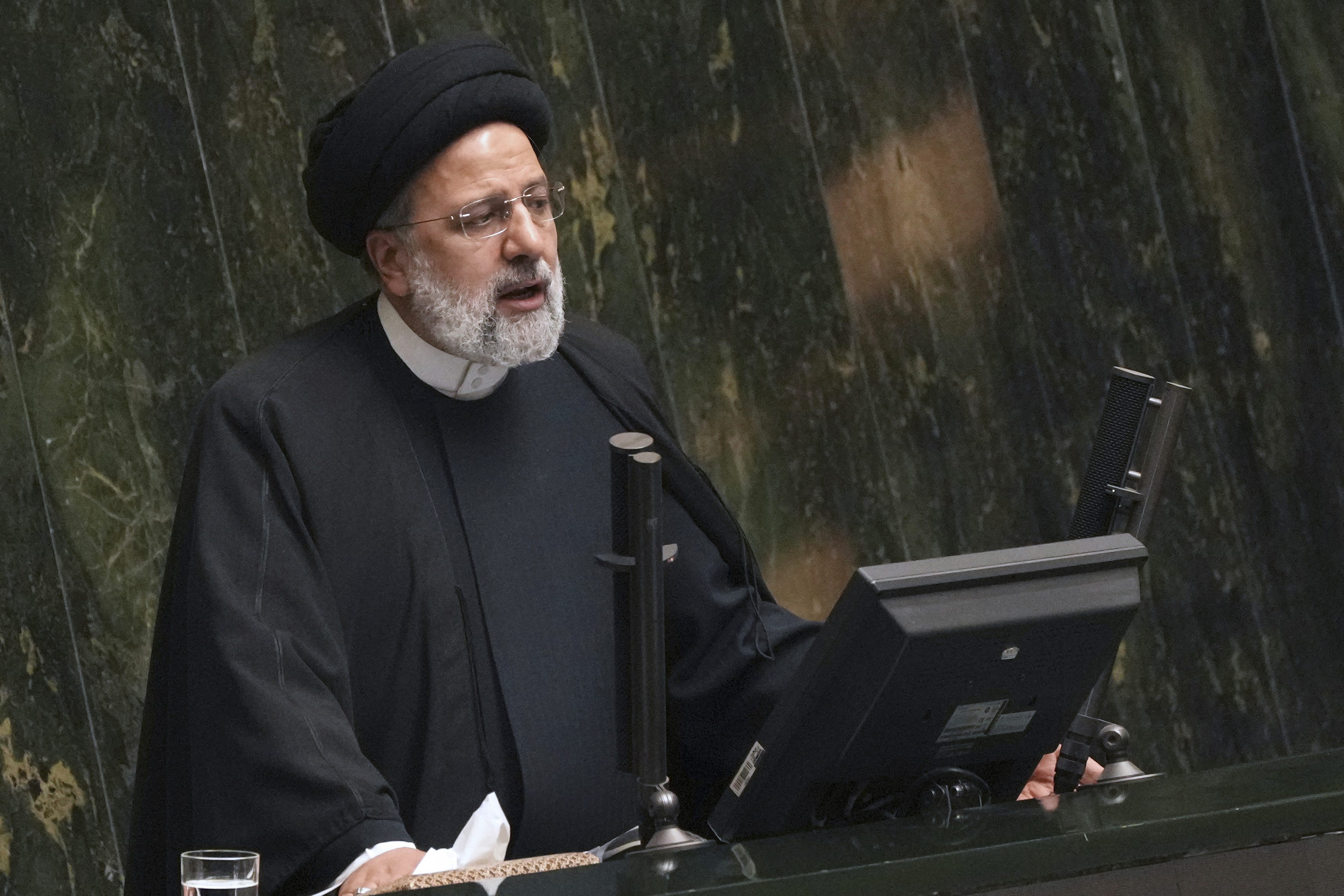 FILE - Iranian President Ebrahim Raisi addresses lawmakers while defending his next year's budget bill at the parliament in Tehran, Iran, Sunday, Jan. 22, 2023. Raisi on Wednesday, March 1, ordered authorities to investigate a series of incidents in which noxious fumes have sickened students at girls' schools, which some officials suspect are attacks targeting women's education.(AP Photo/Vahid Salemi, File)