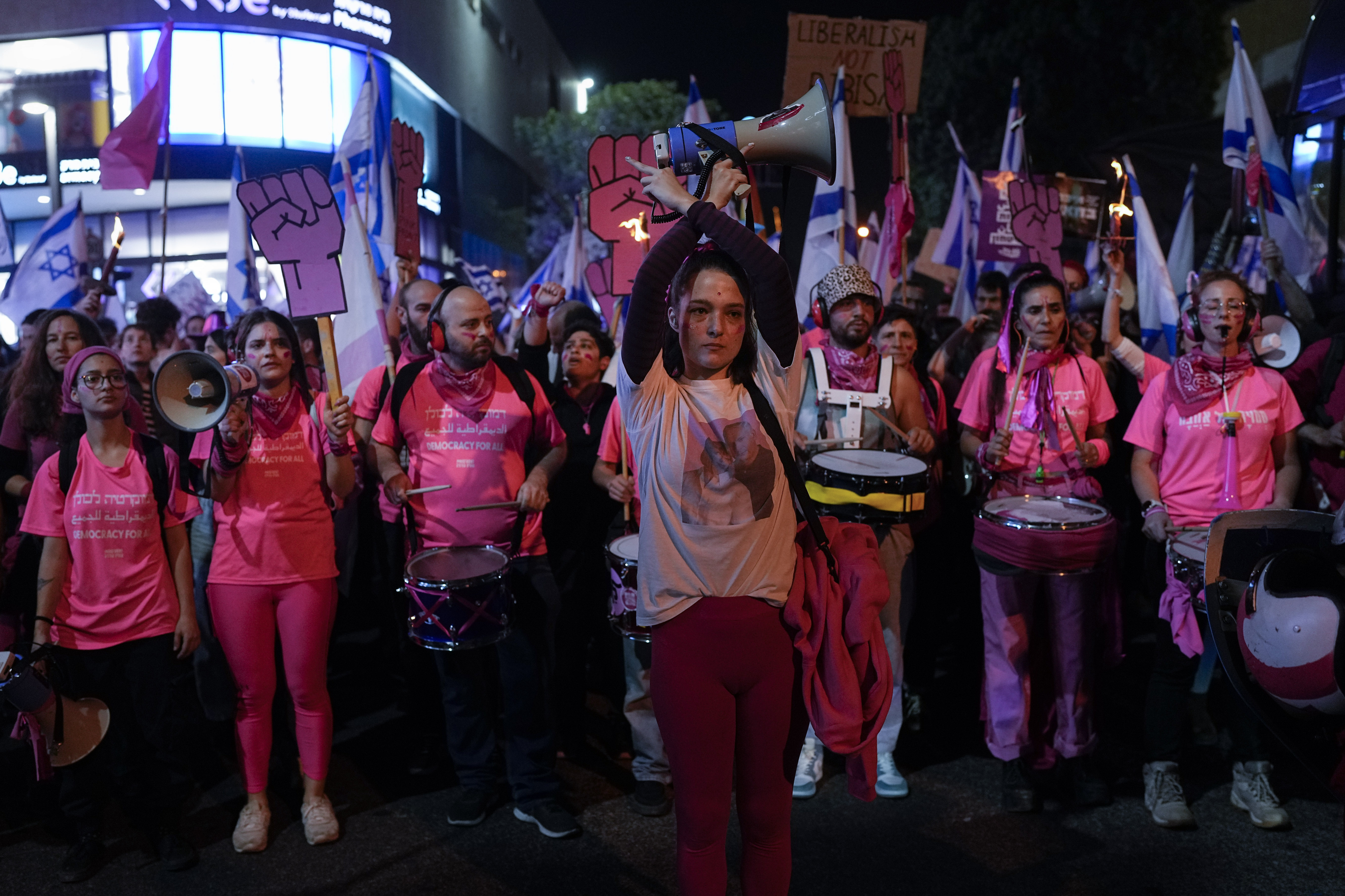 Israelis protest against plans by Prime Minister Benjamin Netanyahu's new government to overhaul the judicial system, in Tel Aviv, Israel, Saturday, March 4, 2023. (AP Photo/Ohad Zwigenberg)