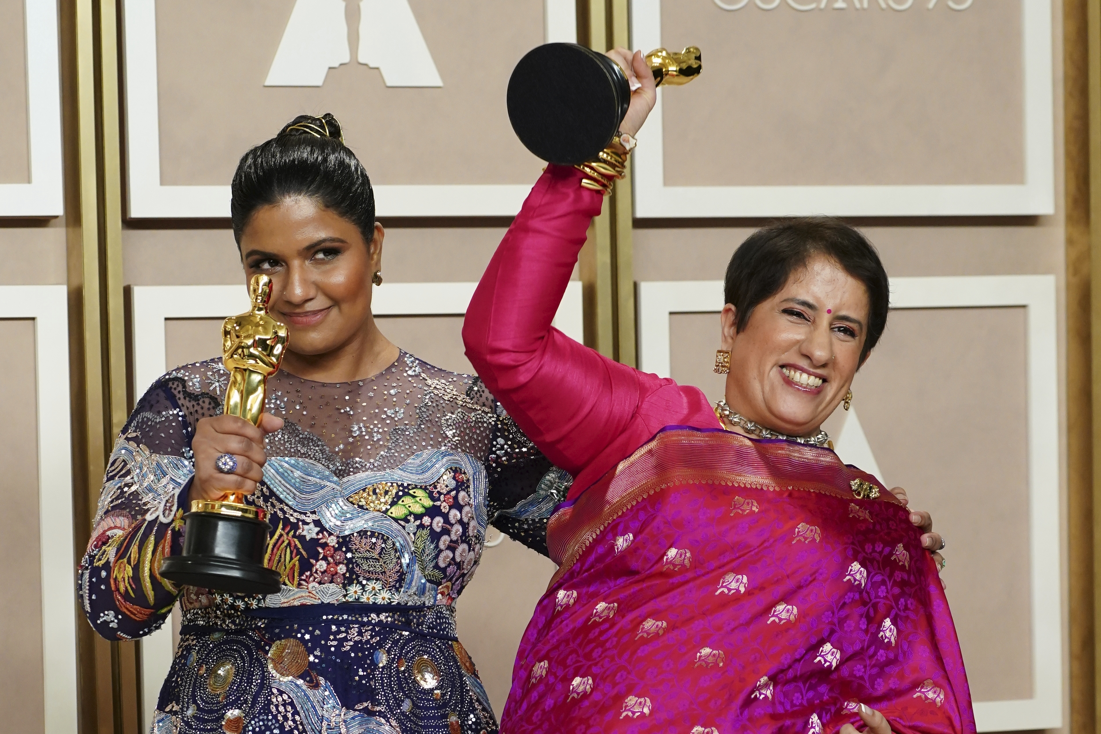 Kartiki Gonsalves, left, and Guneet Monga pose with the award for best documentary short film for "The Elephant Whisperer" in the press room at the Oscars on Sunday