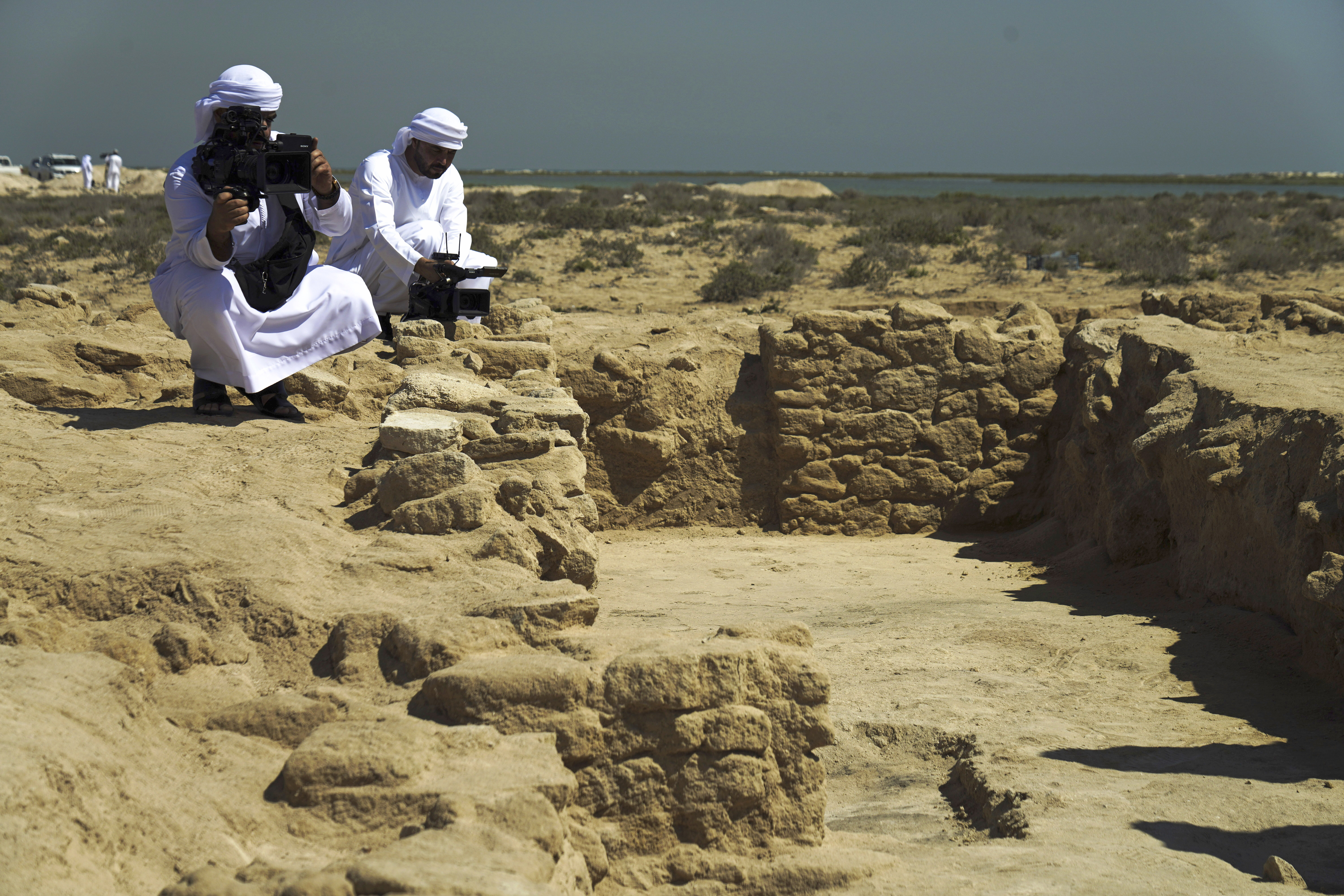 Journalists film uncovered ruins on Siniyah Island in Umm al-Quwain, United Arab Emirates, Monday, March 20, 2023