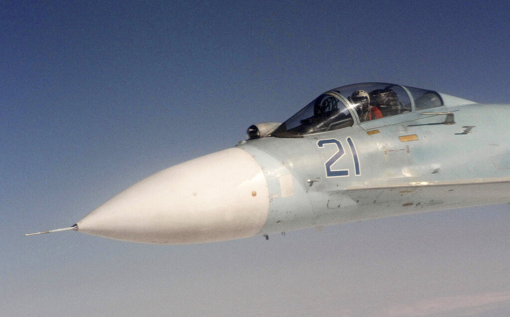 A photo made Tuesday, Aug. 27, 2013, over the Bering Strait near Alaska shows a Russian Federation Air Force SU-27 during a simulation of a hijacking of a passenger plane. The exercise had Canadian and U.S. forces from NORAD, working with the Russian Federation forces and saw the Canadians successfully hand off the hijacked plane to Russian fighters over the Bering Strait. (AP Photo/Mark Thiessen