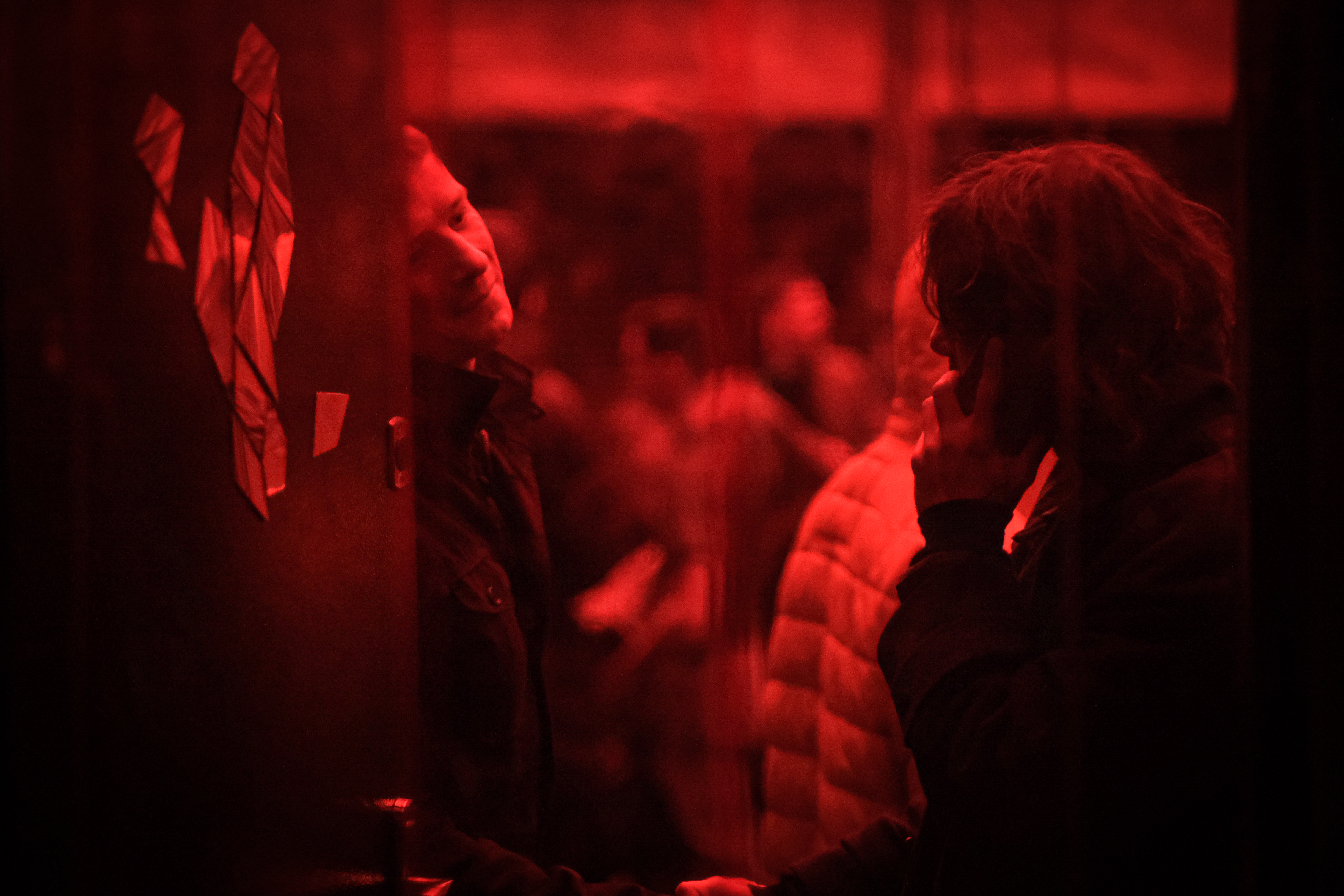 A photo of a security person welcoming someone.