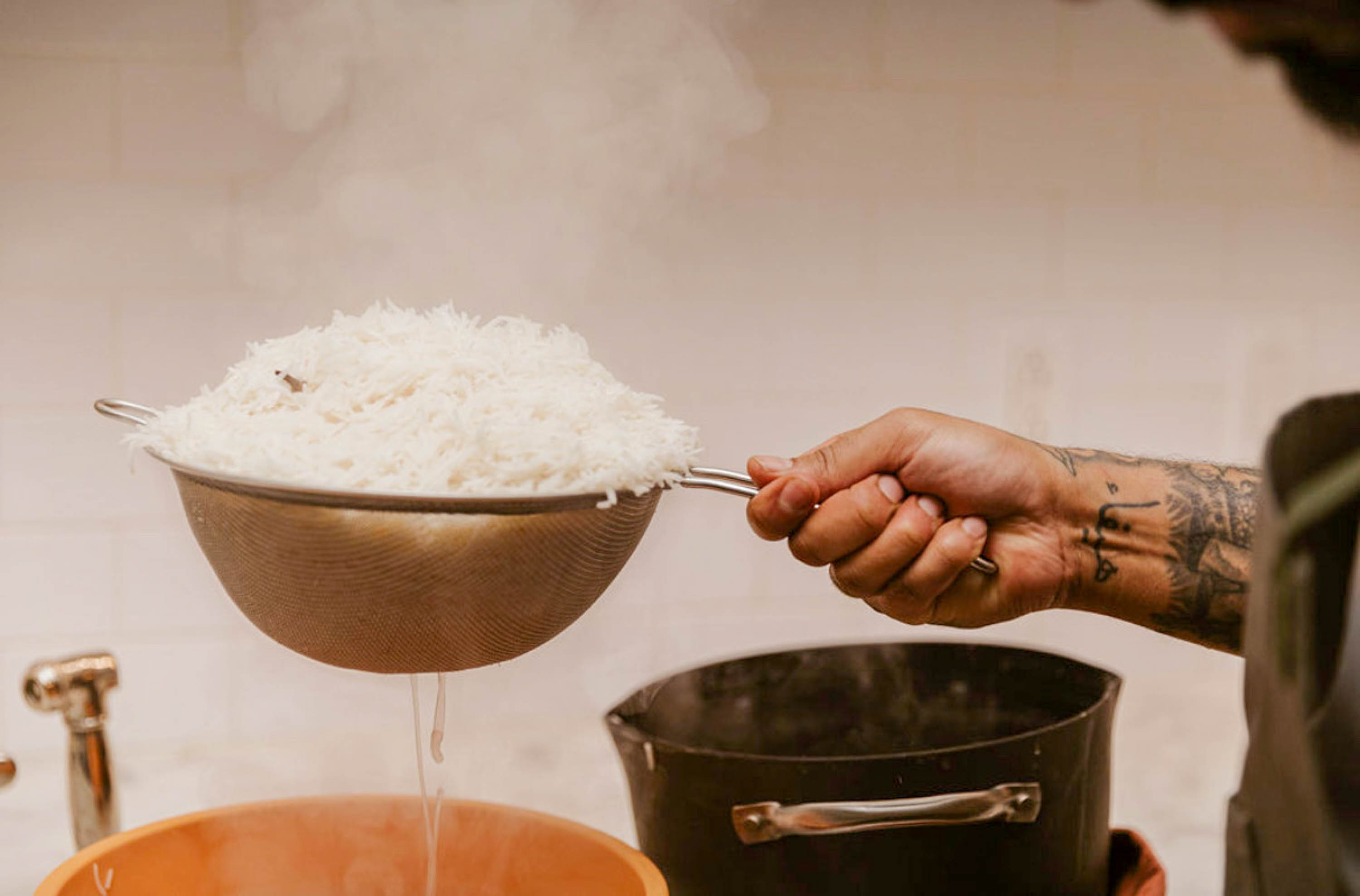 Akram Said strains the rice