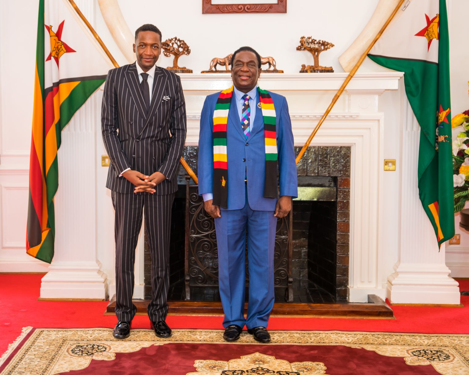 Diplomat at Large Uebert Angel with Zimbabwean President Emmerson Mnangagwa