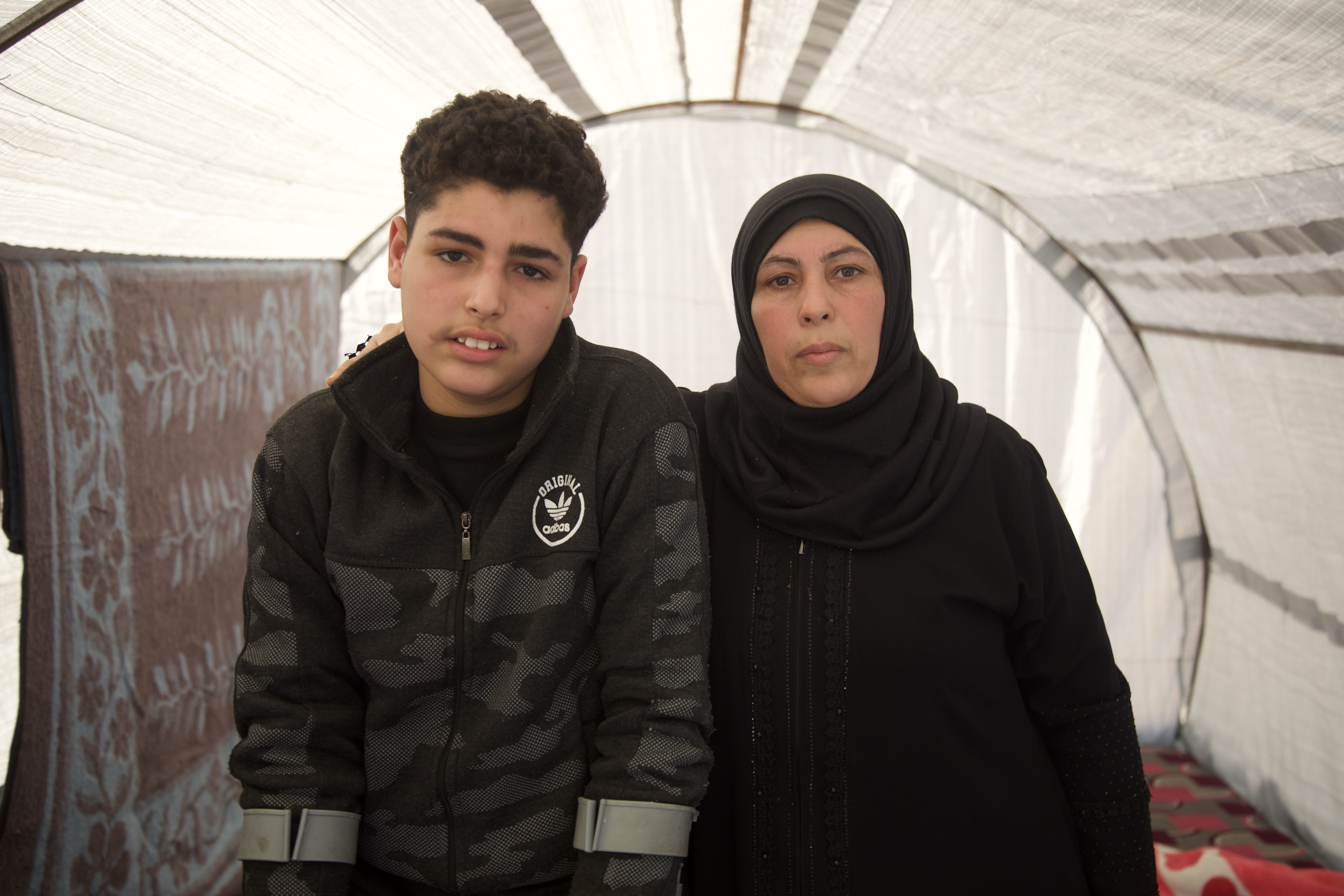Moufida Ghanem and her son Ali in their tent last year