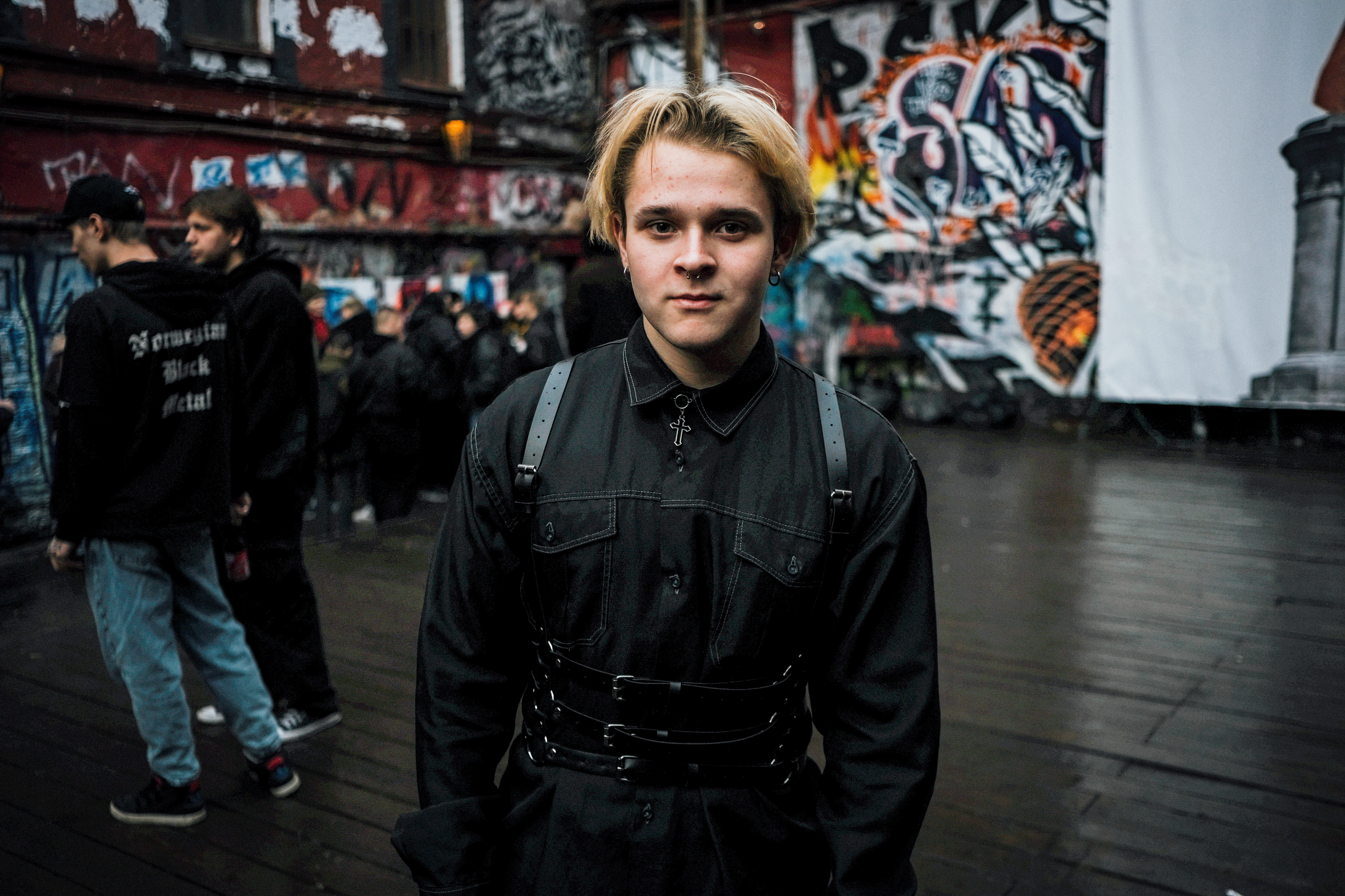 A photo of a person standing outside.