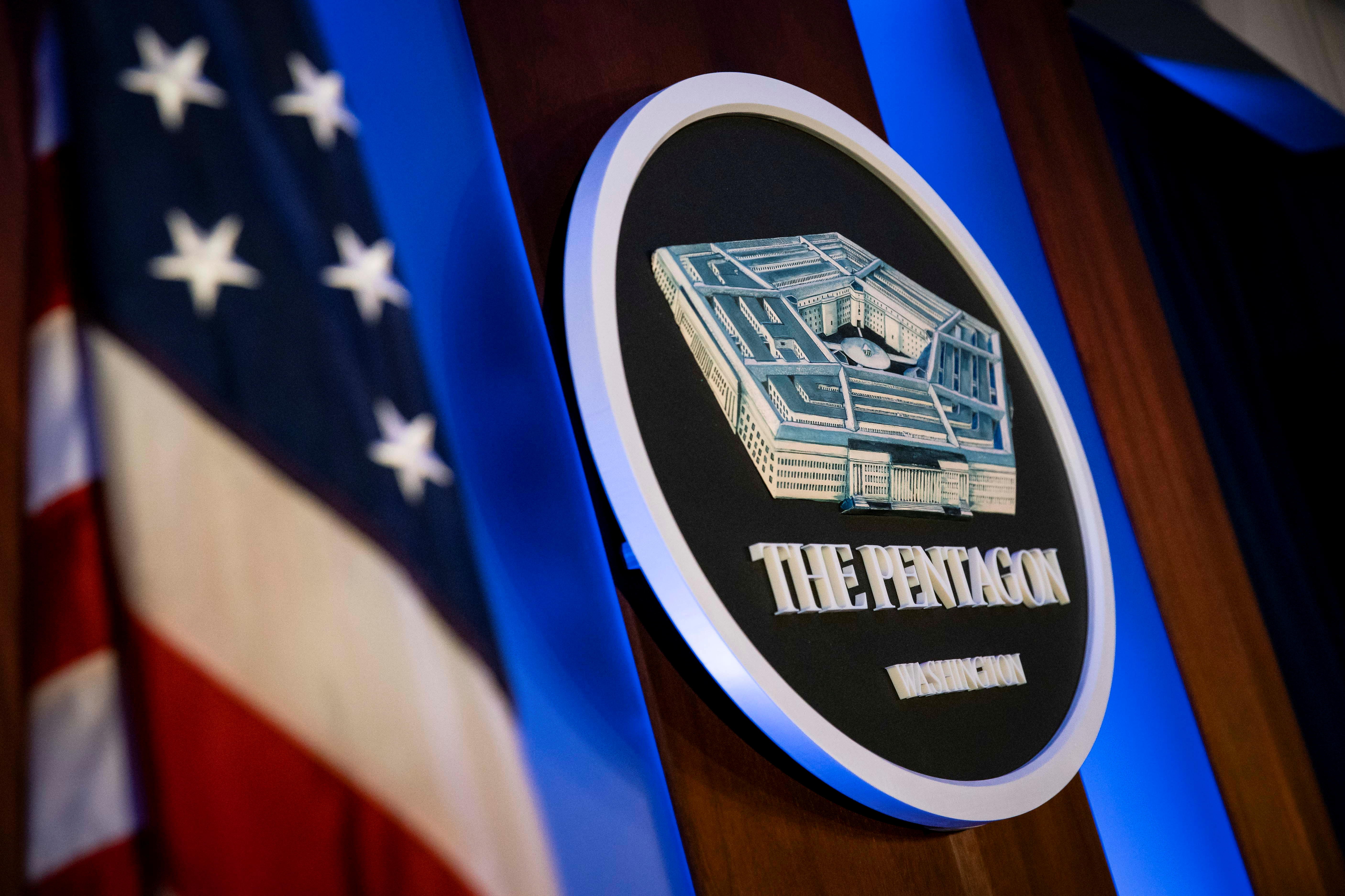 The Pentagon logo is seen with the US flag in the background.