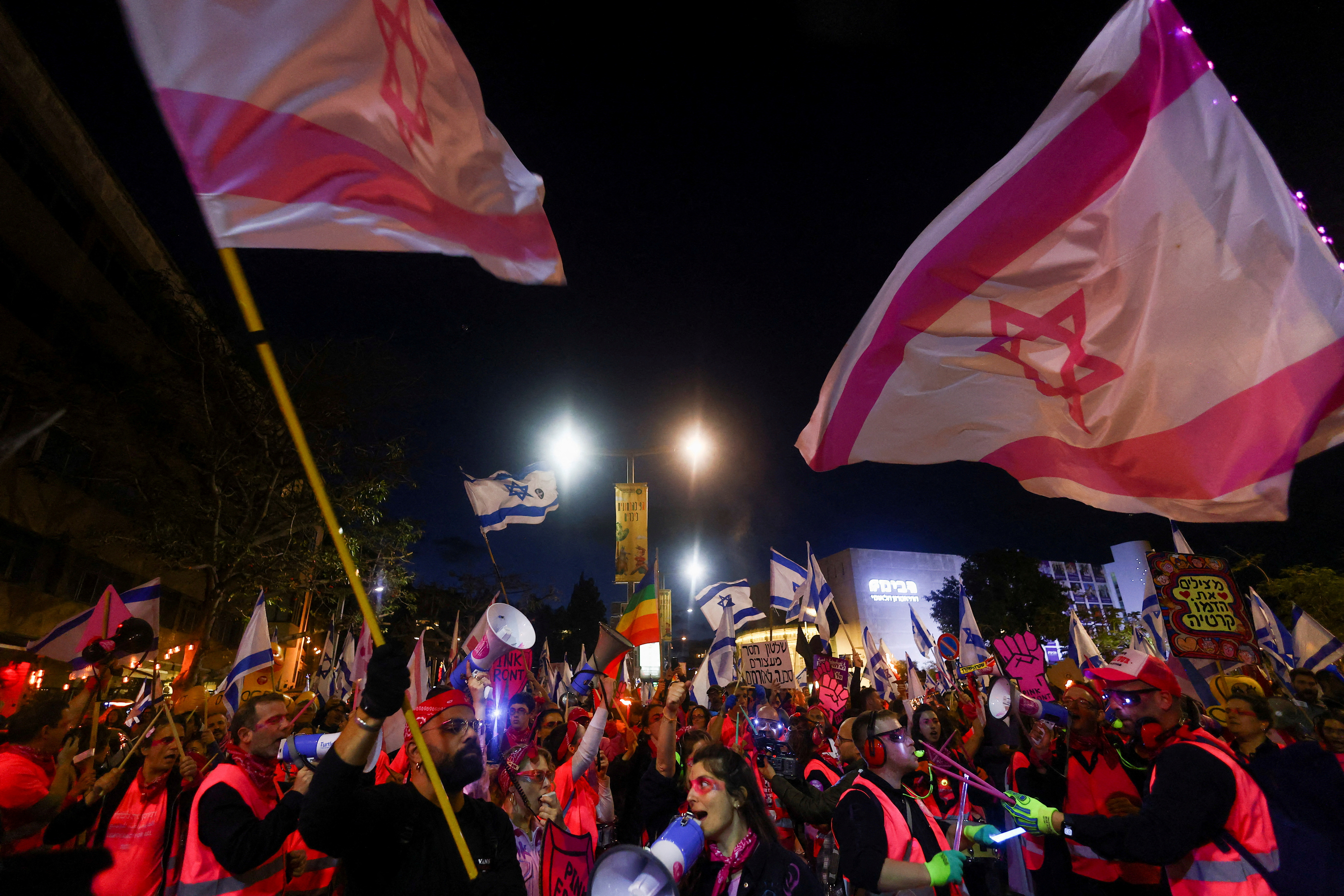 People take part in a demonstration against Israeli PM