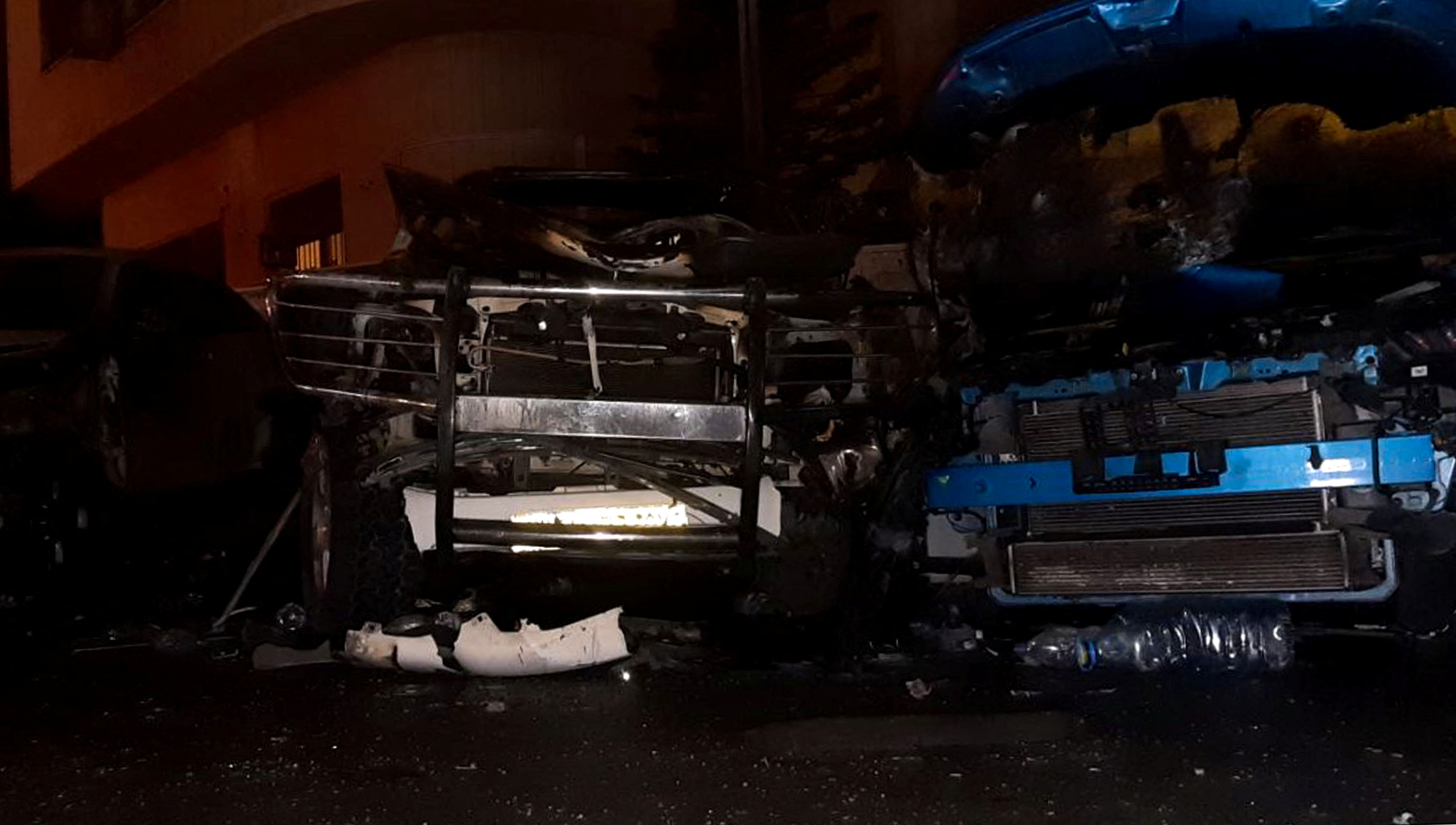 Damaged vehicles are pictured at the site of a car bomb blast in Damascus