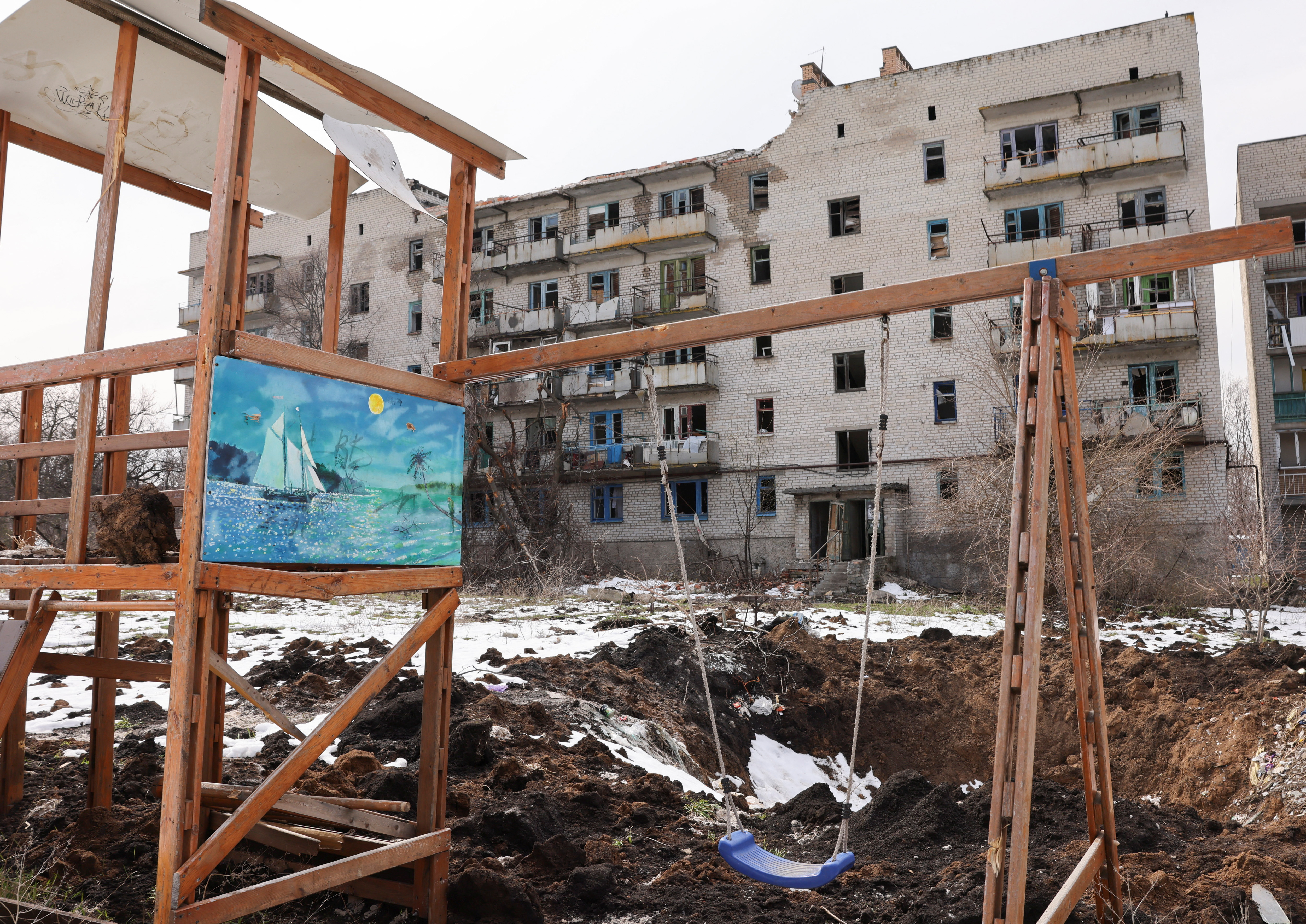 A view shows a crater from recent shelling at a playground