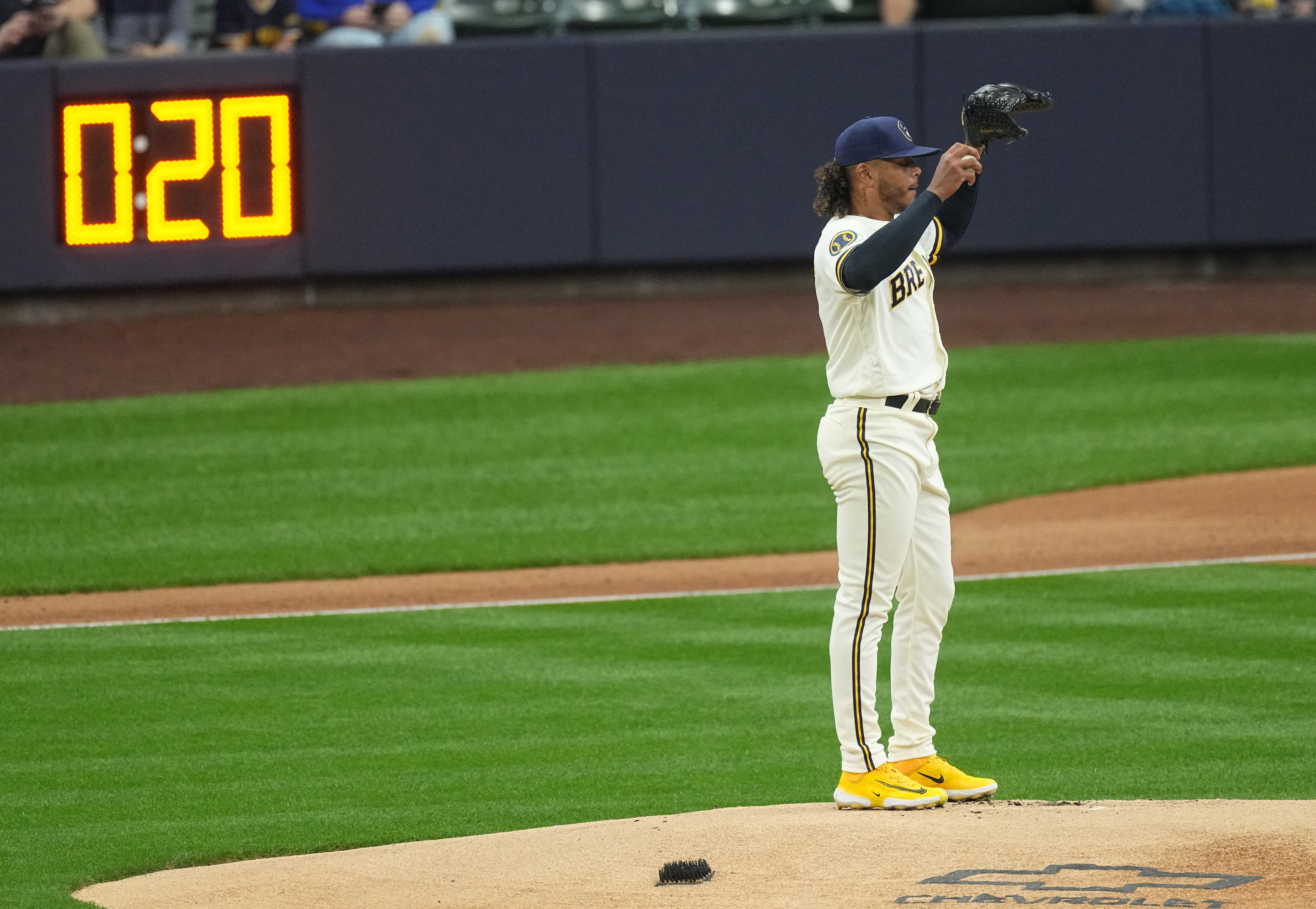 The MLB pitch clock is seen as Milwaukee Brewers starting pitcher Freddy Peralta stands on the mound