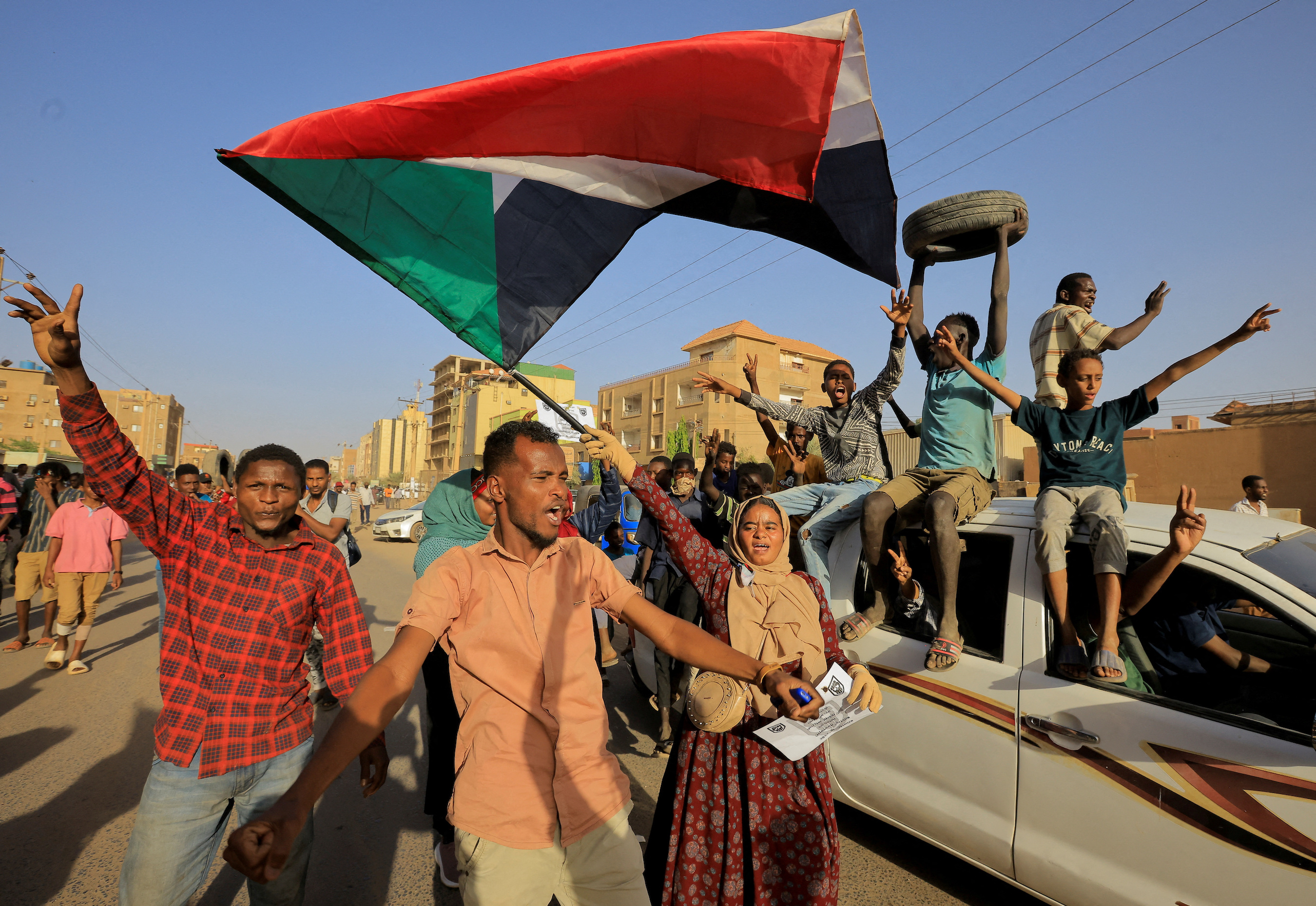 Protesters march during a rally marking the anniversary of the April uprising, in Khartoum, Sudan.