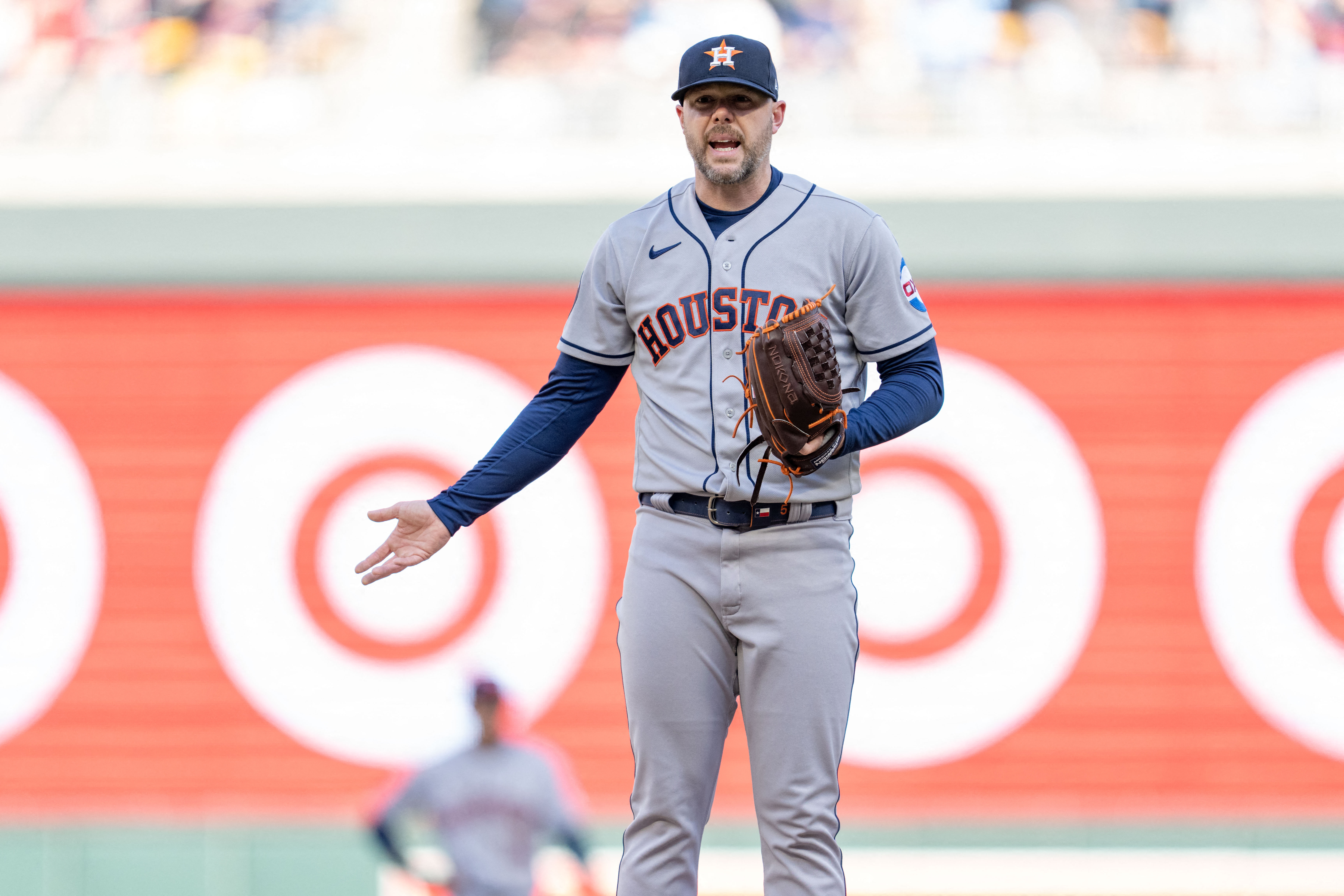 Houston Astros relief pitcher Ryan Pressly (55) argues a pitch clock violation against the Minnesota Twins in the ninth inning at Target Field