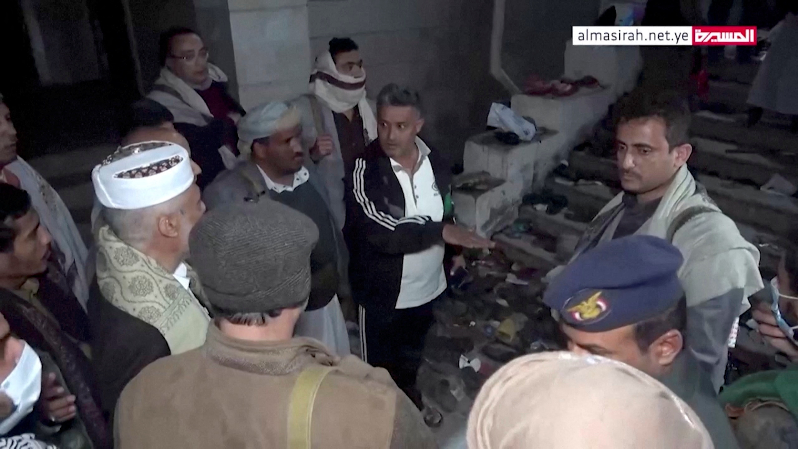 Officials visit the site after a stampede in Sanaa