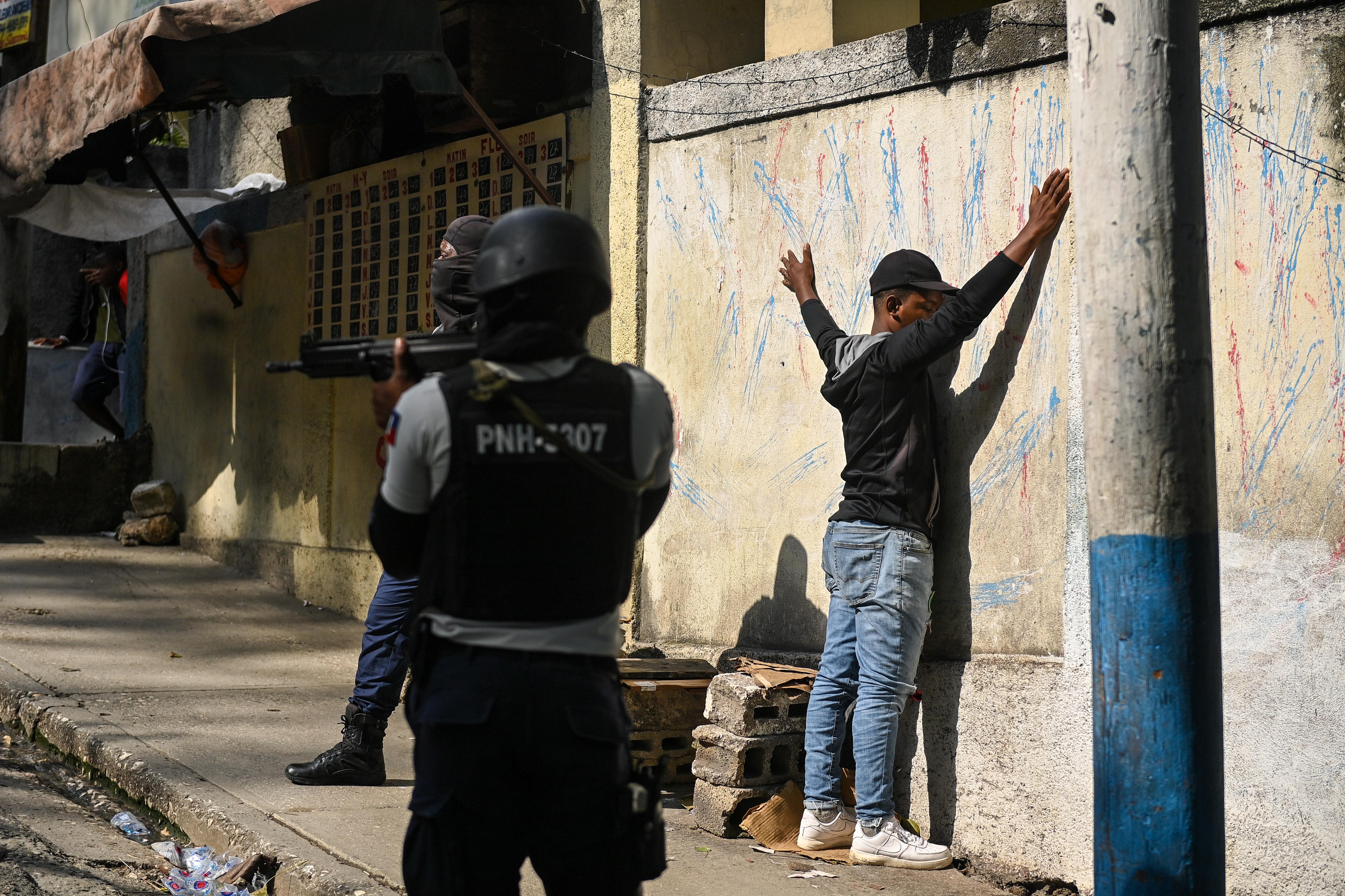 A man is under arrest by Haitian police in the Turgeau commune of Port-au-Prince, Haiti, during gang-related violence on April 24, 2023.