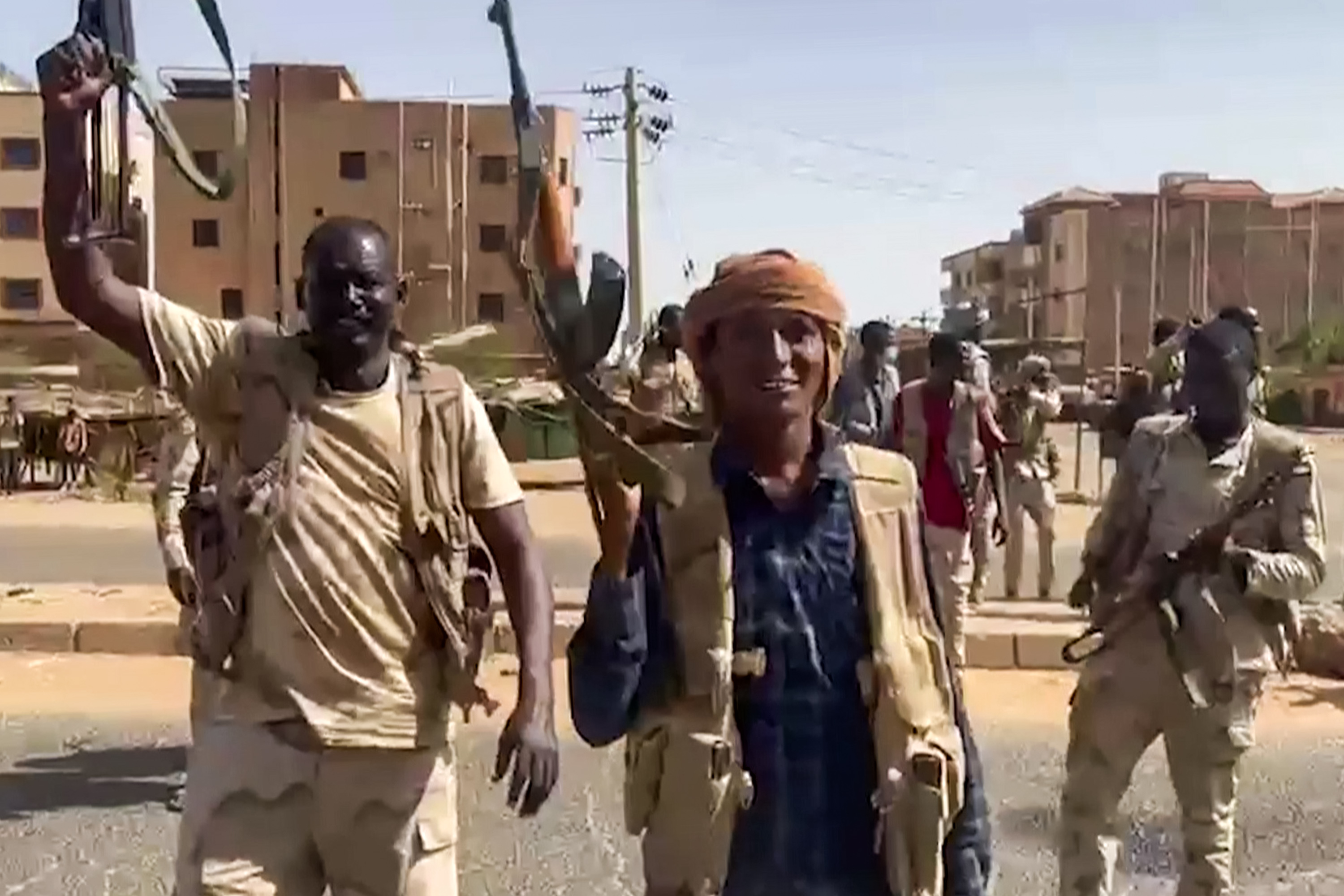 RSF fighters holding their guns aloft in eastern Khartoum.