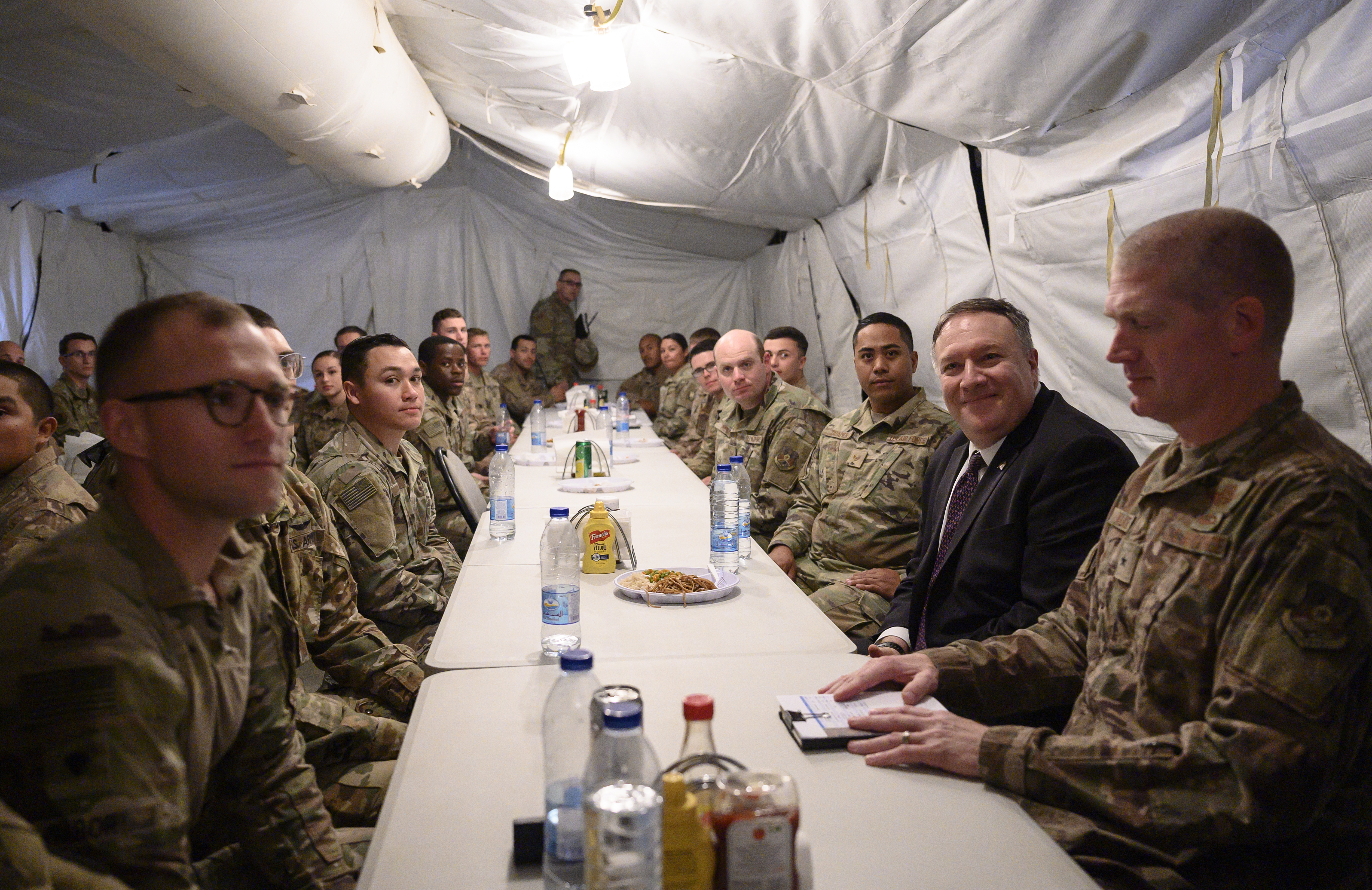 US Secretary of State Mike Pompeo shares lunch with members of the military as he visits the Prince Sultan air base in Al-Kharj, in central Saudi Arabia Thursday, Feb. 20, 2020. Pompeo met with Saudi Arabia's King Salman on Thursday in a visit focused primarily on discussing shared security concerns about regional rival Iran. (Andrew Caballero Reynolds/Pool via AP)