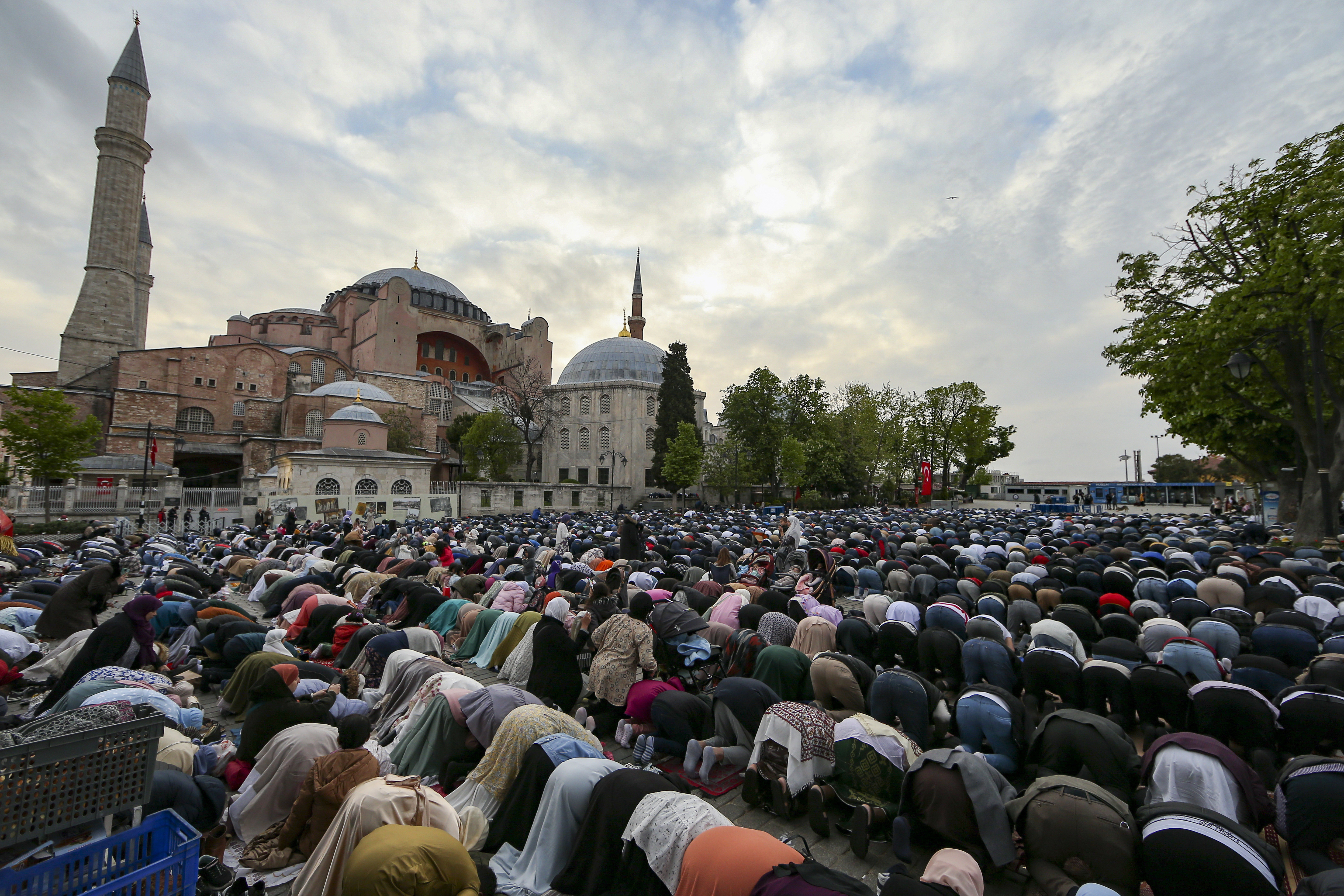 Muslims offer prayers during the first day of Eid al-Fitr, which marks the end of the holy month of Ramadan, outside the iconic Haghia Sophia Mosque in Istanbul, Turkey, May 2, 2022 [File: Emrah Gurel/AP Photo]