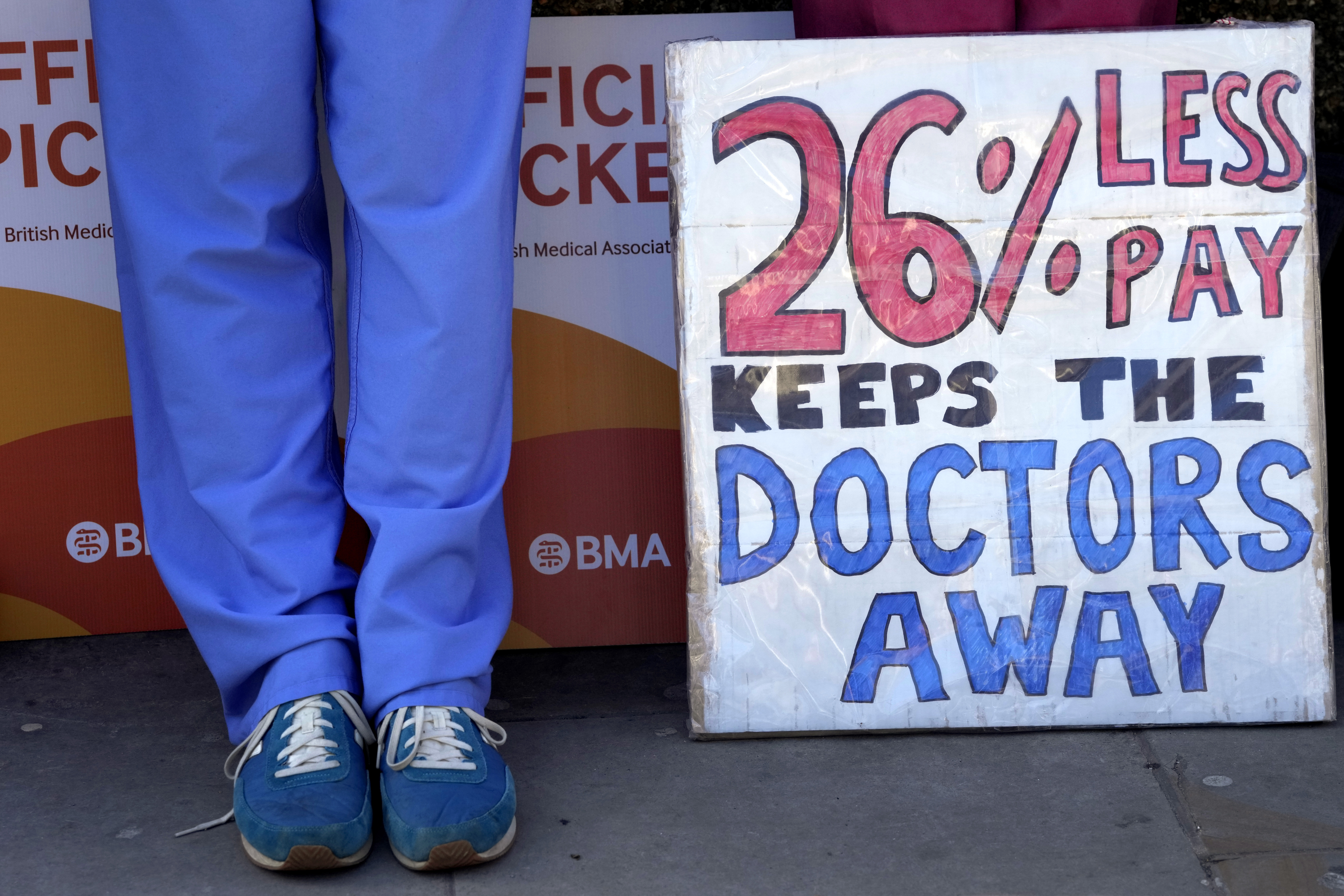 Junior doctors stand on the picket line outside St Thomas' Hospital in Westminster in London.