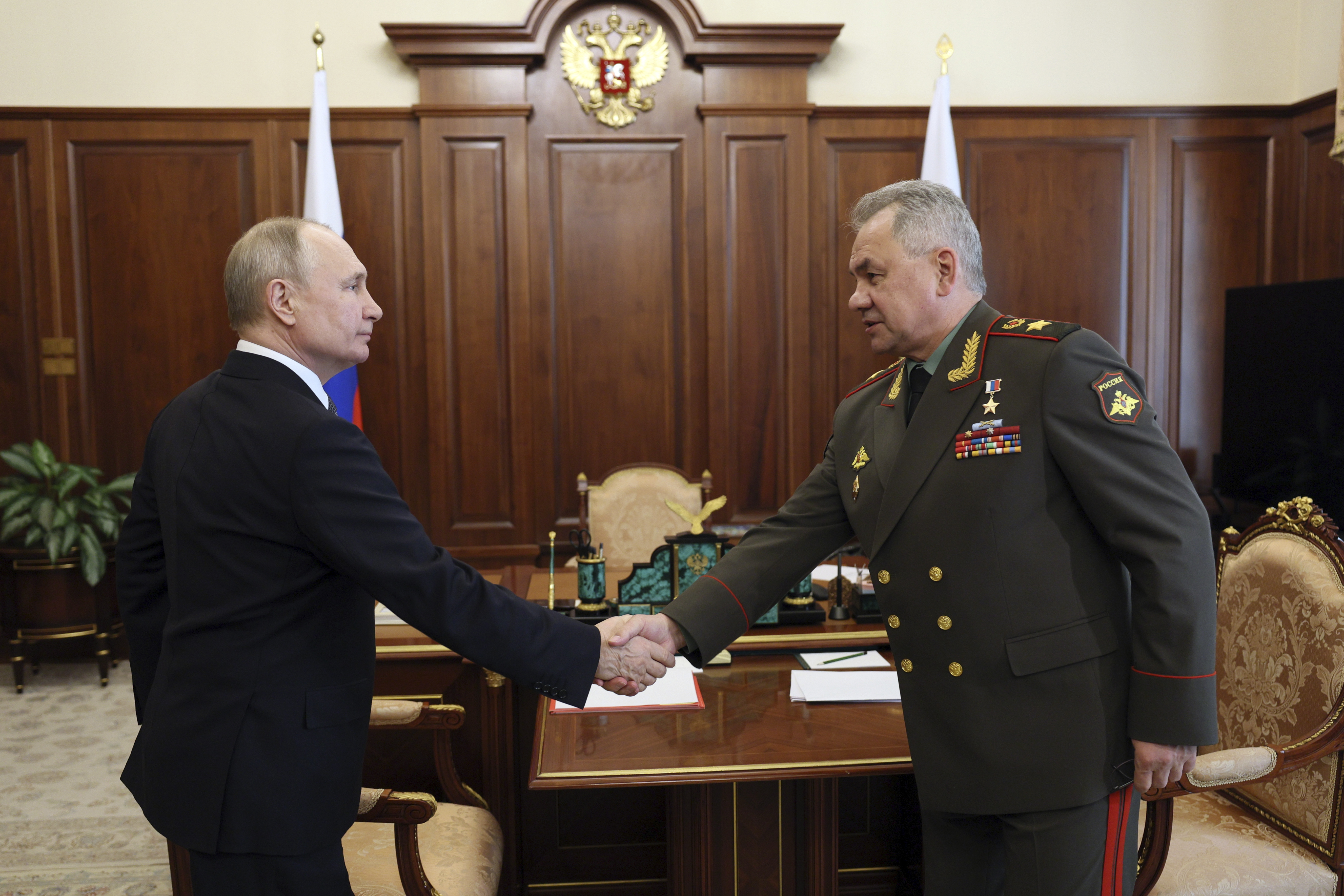Russian President Vladimir Putin and Russian Defence Minister Sergey Shoigu