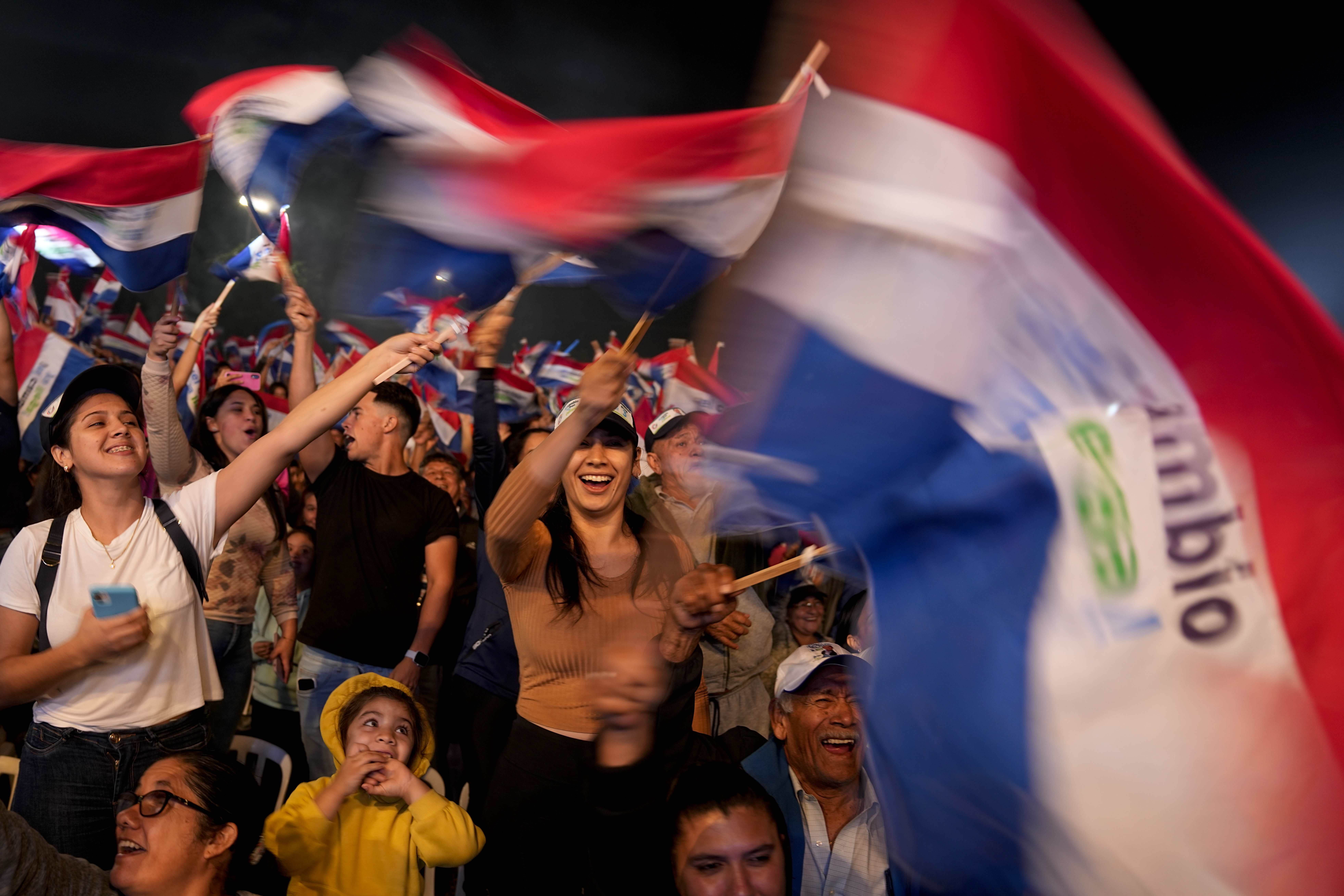 FILE - Supporters of Efrain Alegre, presidential candidate for the Concertacion coalition, cheer during his closing campaign rally in Asuncion, Paraguay, April 27, 2023. Alegre, a 60-year-old lawyer, is making his third bid for the presidency. Paraguay's general elections are scheduled for Sunday, April 30th. (AP Photo/Jorge Saenz, File)