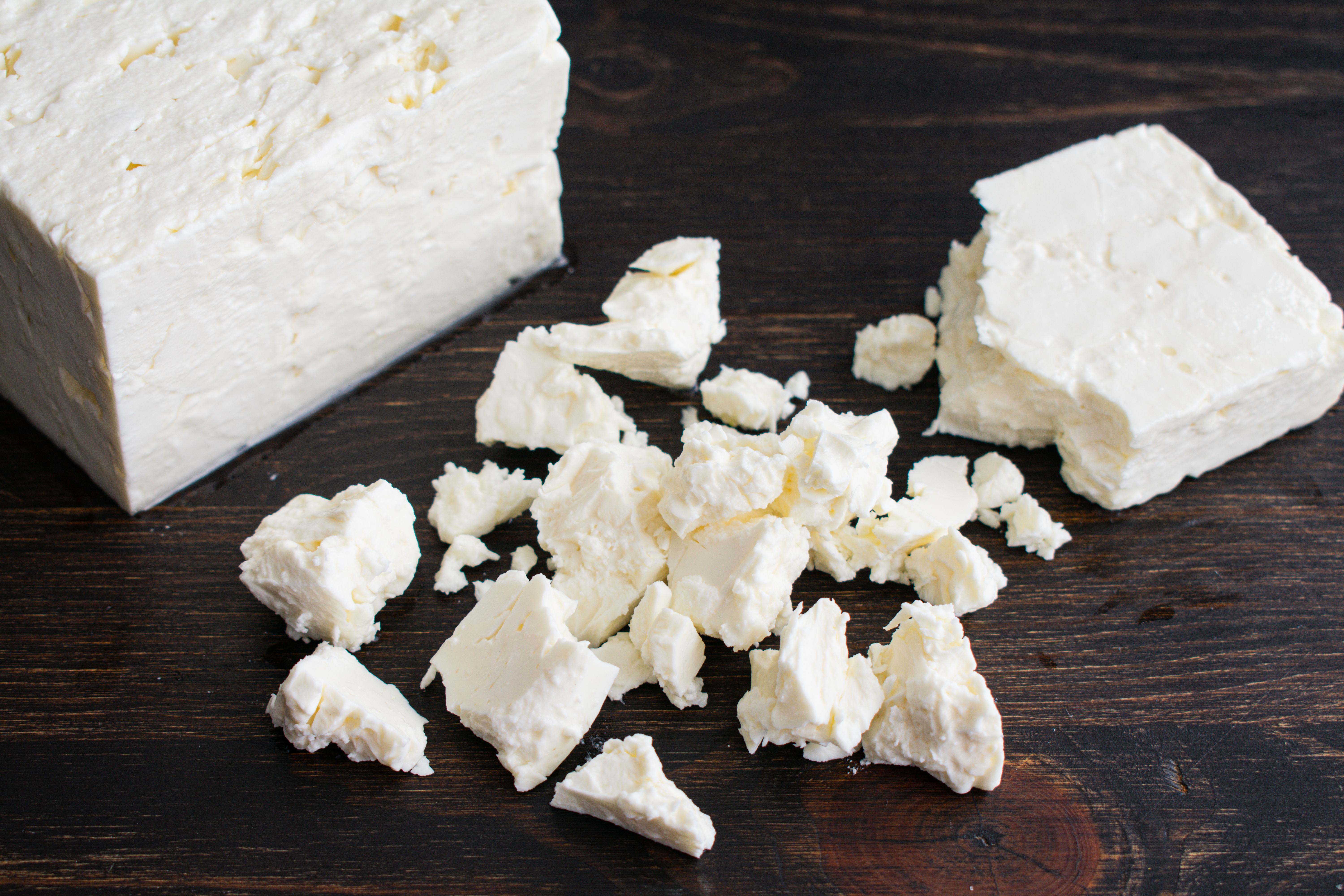 crumbled feta on a cutting board