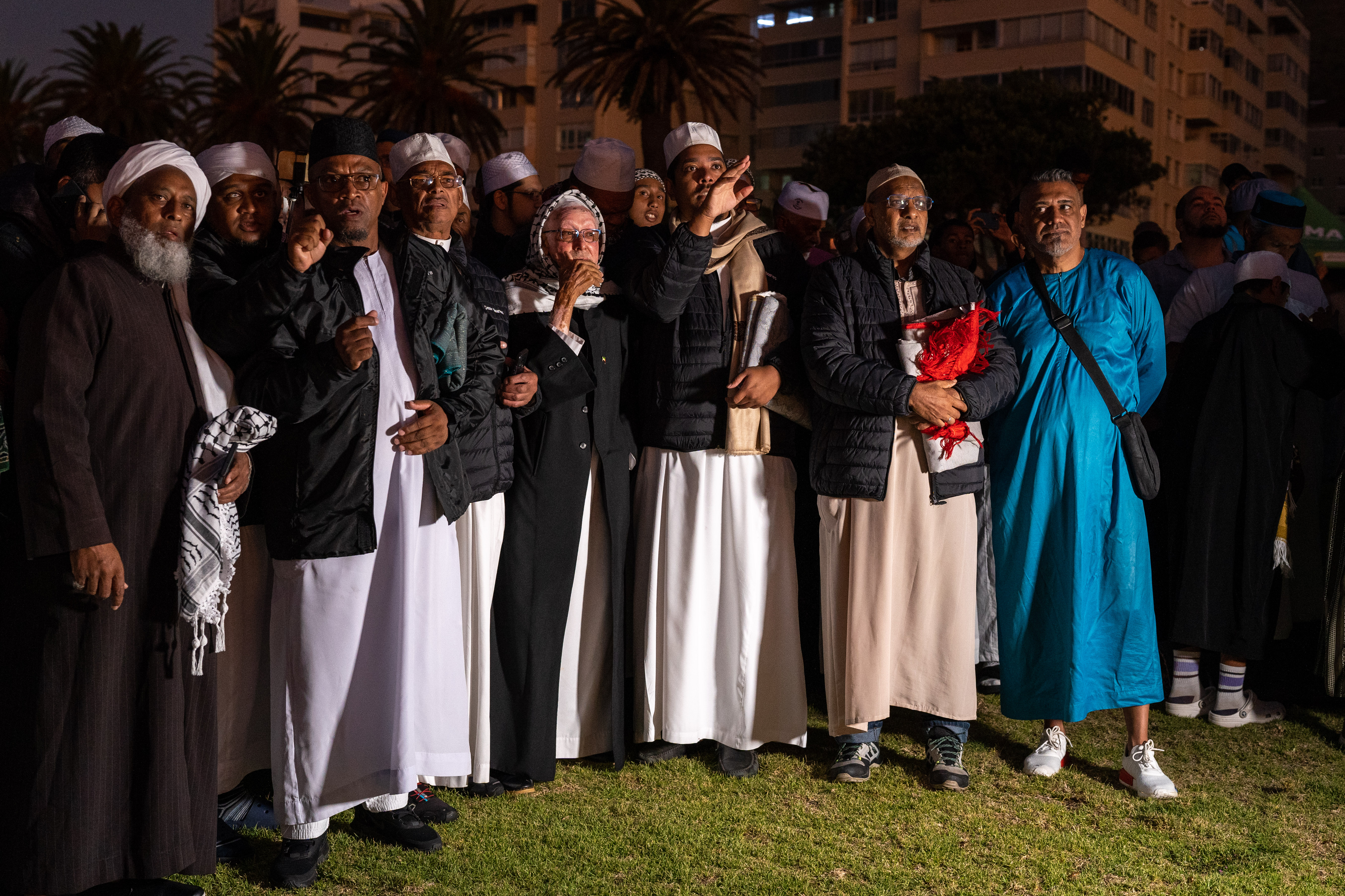 A photo of a group of people standing.