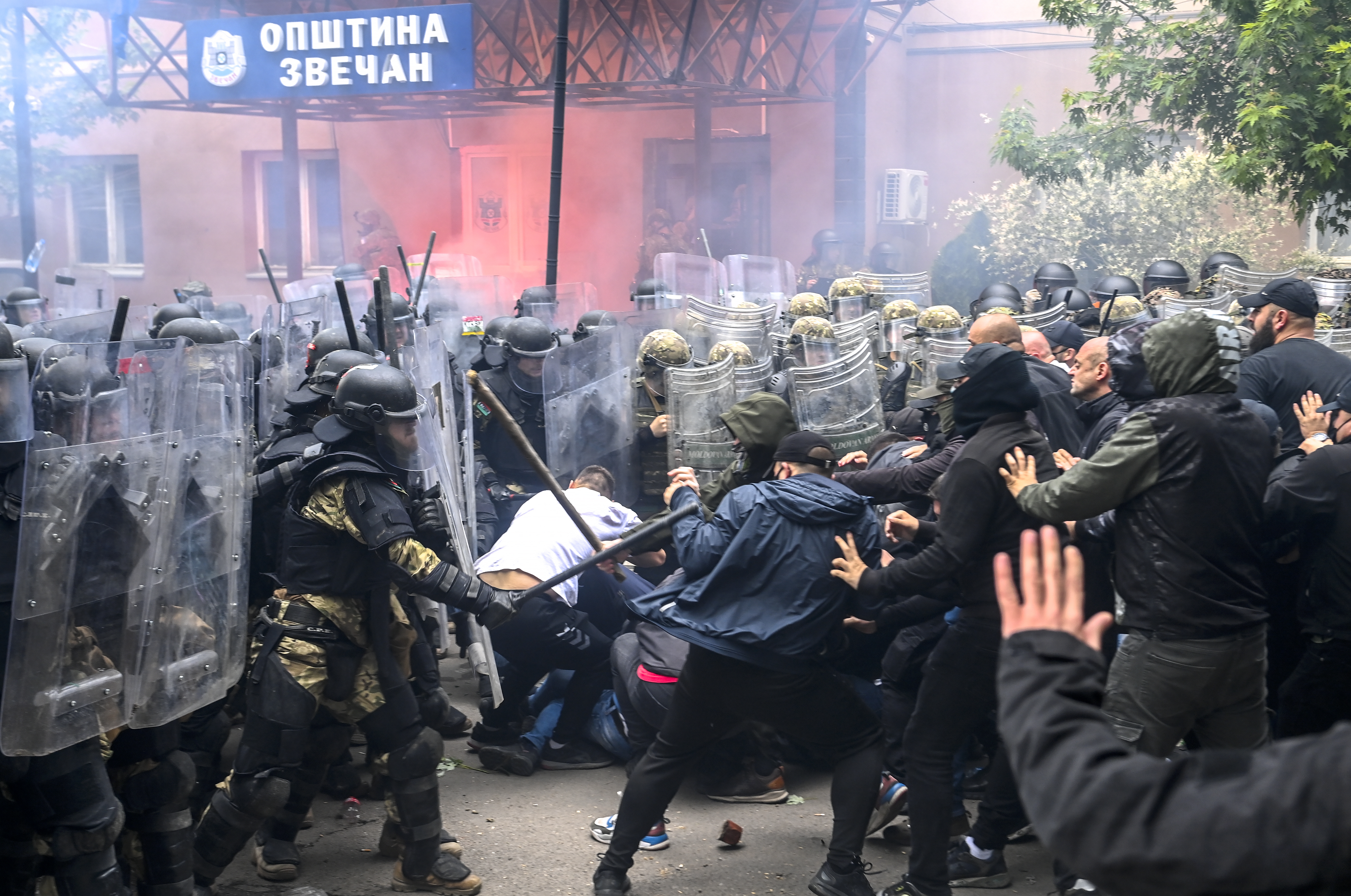 Soldiers of NATO-led international peacekeeping Kosovo Force (KFOR) clash with ethnic Serbs in front of the building of the municipality in Zvecan
