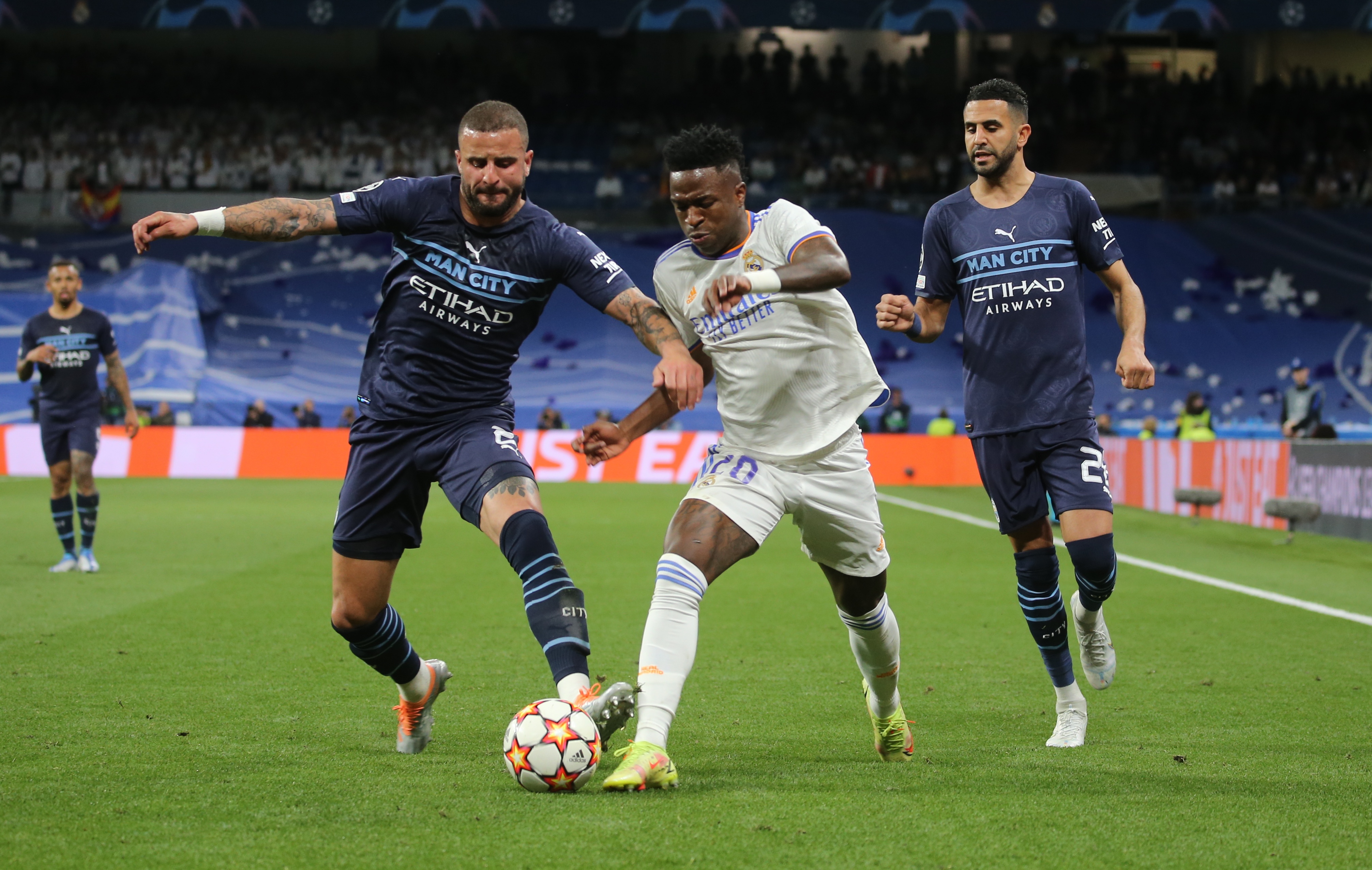 Vinicius Junior in action with Manchester City's Kyle Walker