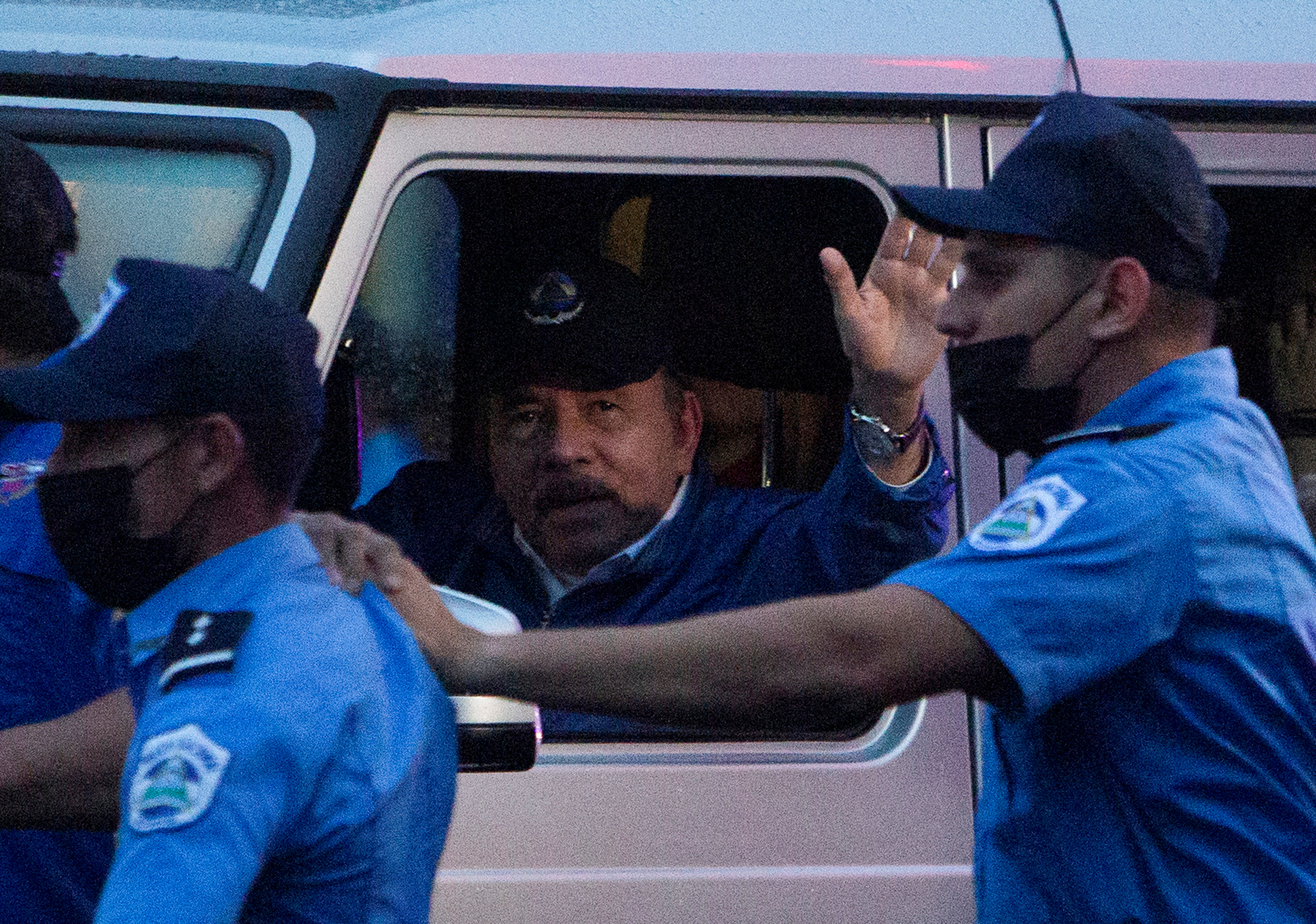 icaragua's President Daniel Ortega arrives as he waves to supporters before attending an event to mark the 43rd anniversary of the Sandinista Revolution, in Managua