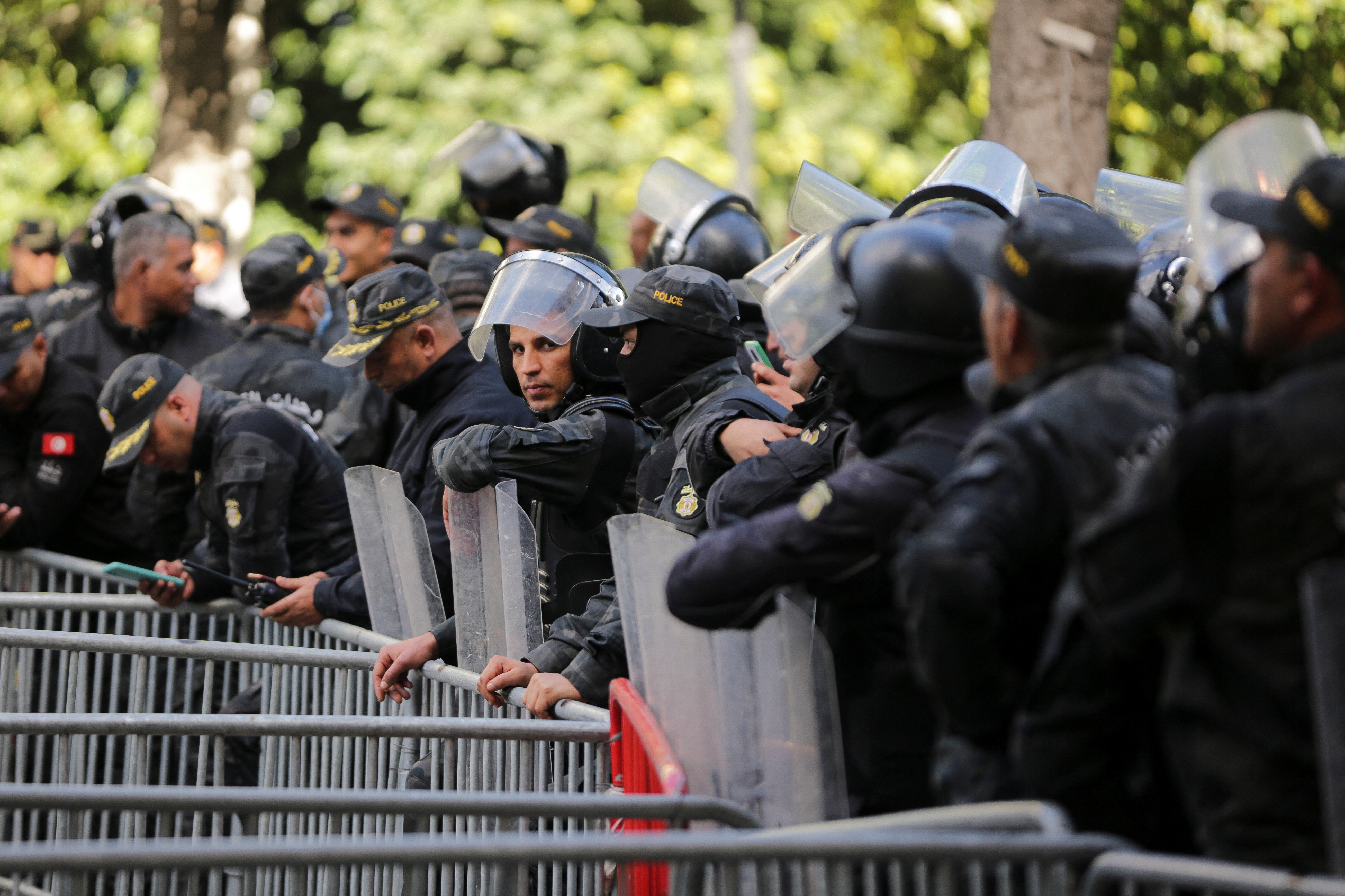 Police officers stand guard