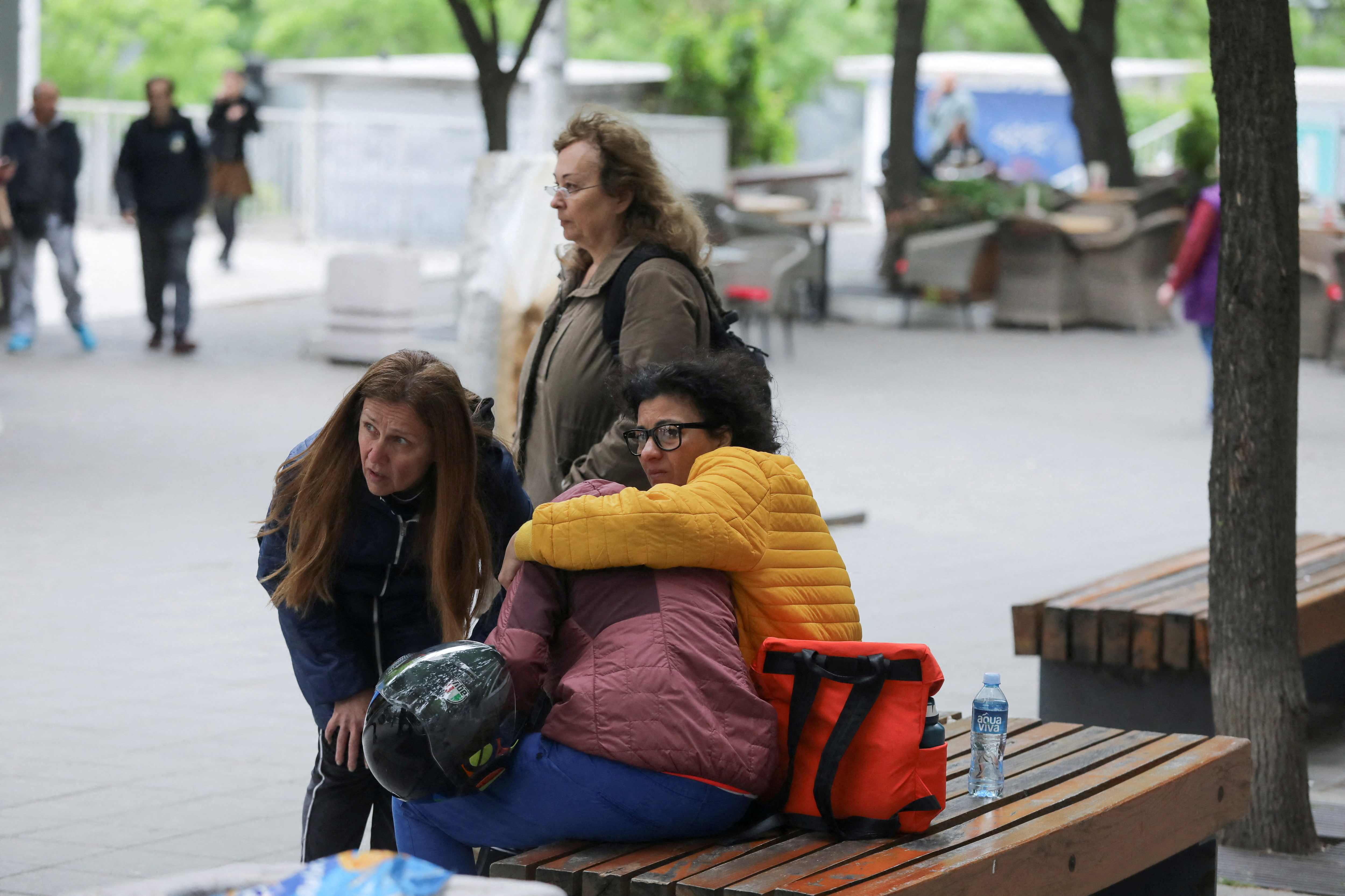 People react after a 14-year-old boy opened fire on other students and security guards at a school in downtown Belgrade, Serbia, May 3, 2023. REUTERS/Djordje Kojadinovic 