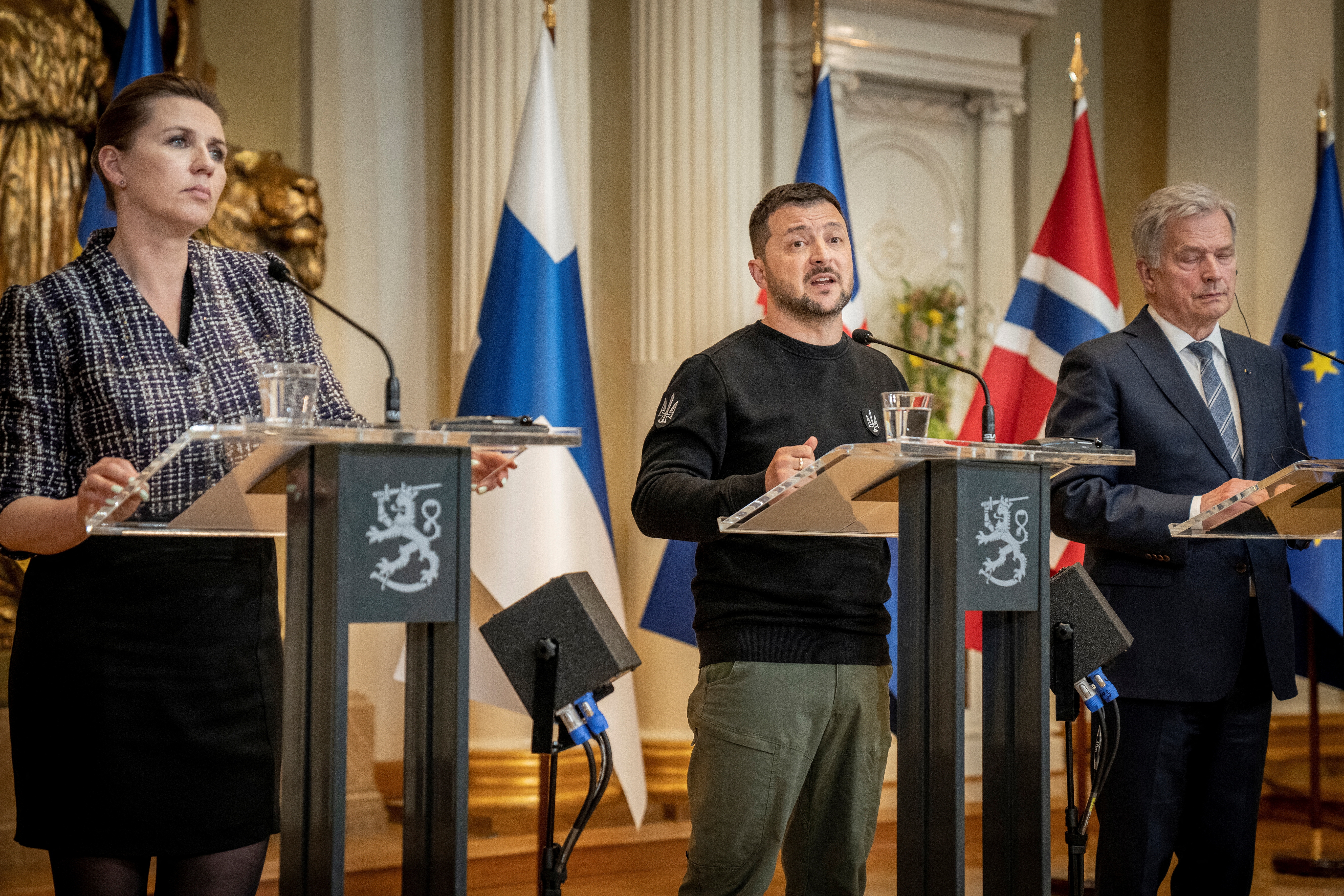 Danish Prime Minister Mette Frederiksen, Ukrainian President Volodymyr Zelenskiy and Finnish President Sauli Niinisto speak during a press conference with the Nordic heads of state during the Nordic-Ukrainian Summit, at the Presidential Palace in Helsinki, Finland, May 3, 2023. Ritzau Scanpix/Mads Claus Rasmussen via REUTERS ATTENTION EDITORS - THIS IMAGE WAS PROVIDED BY A THIRD PARTY. DENMARK OUT. NO COMMERCIAL OR EDITORIAL SALES IN DENMARK.