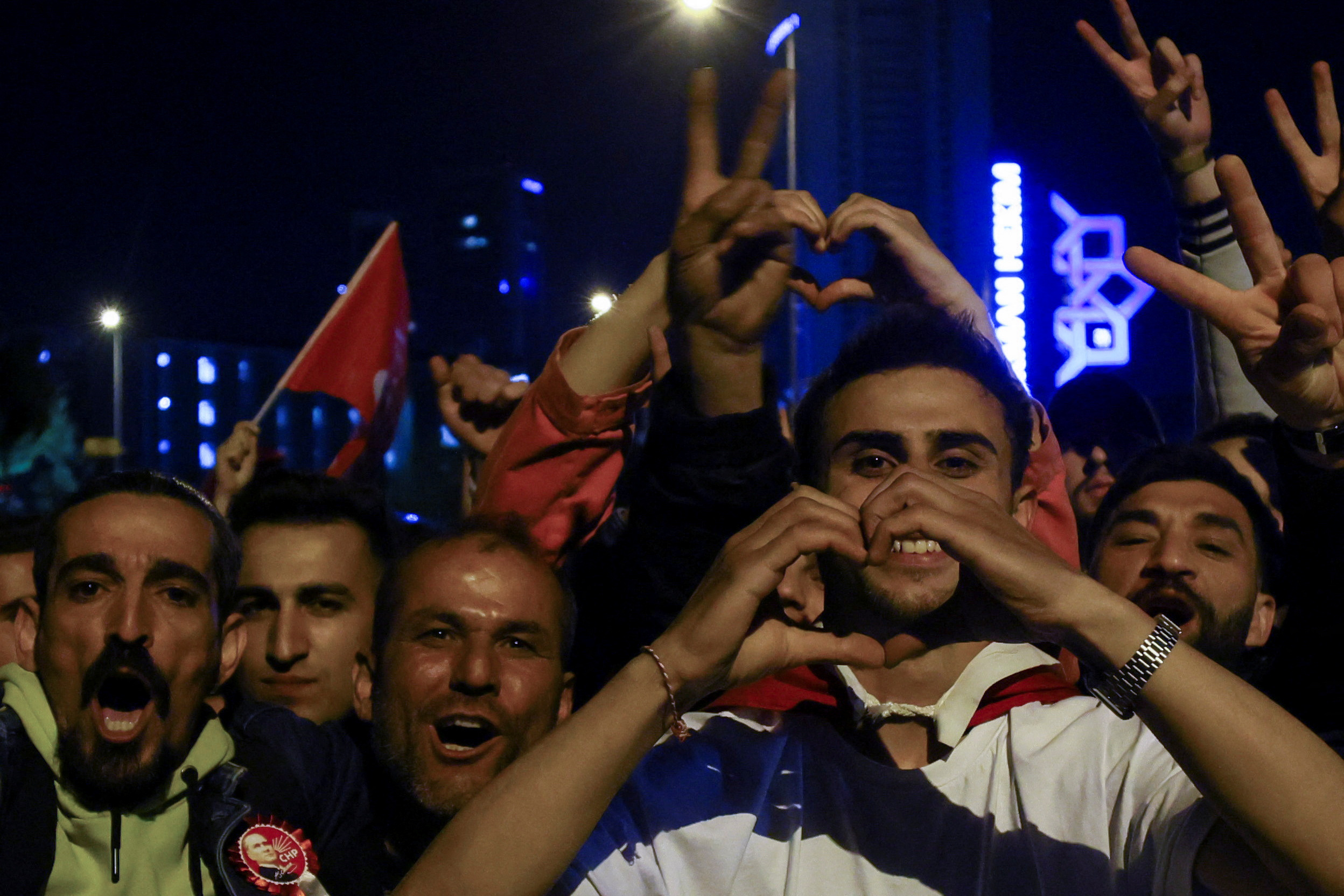 Supporters of Kemal Kilicdaroglu, presidential candidate of Turkey's main opposition alliance, gesture at a rally outside the Republican People's Party (CHP) headquarters as voters await election results in Ankara, Turkey May 14, 2023. REUTERS/Yves Herman