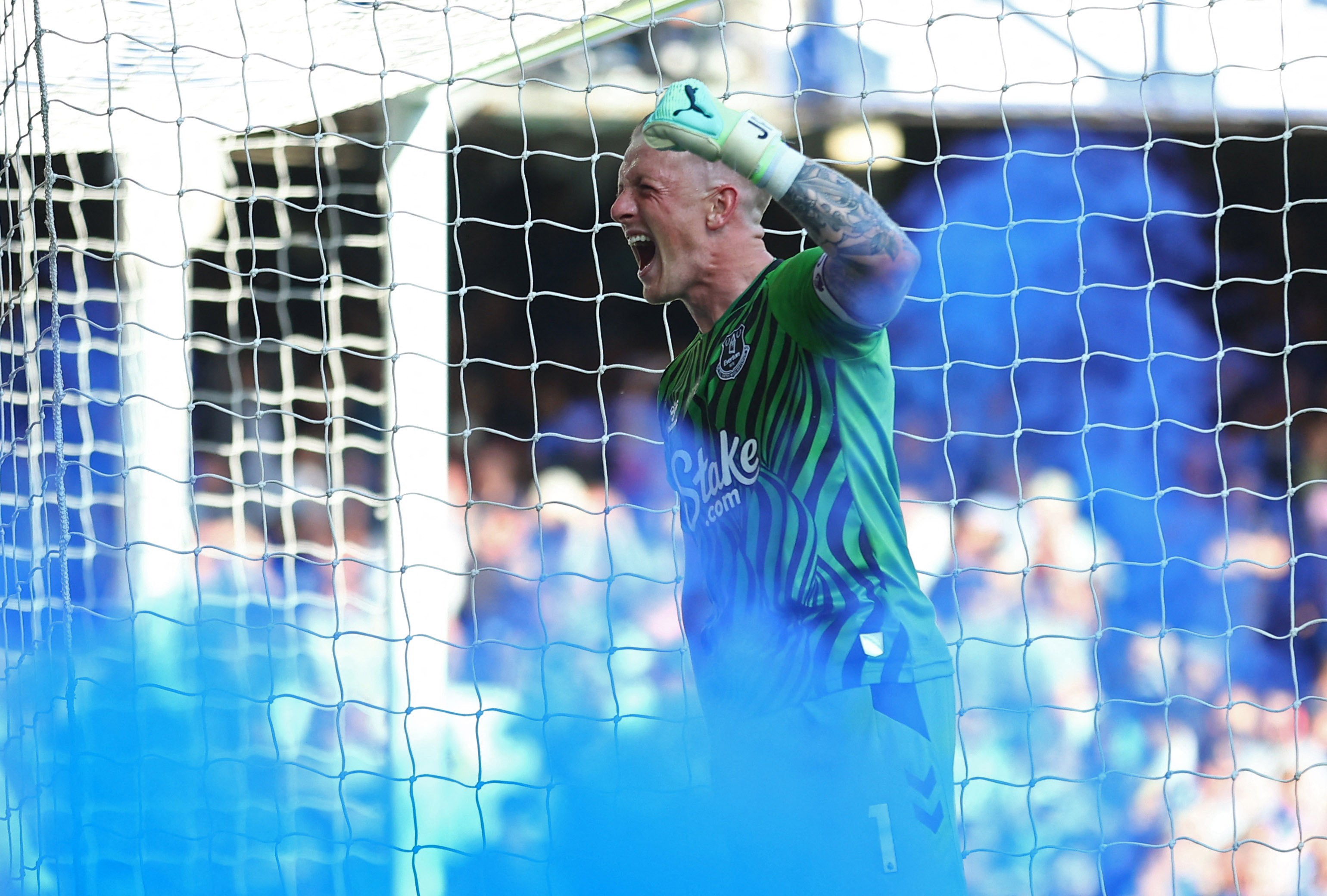 Jordan Pickford celebrates a goal for everton