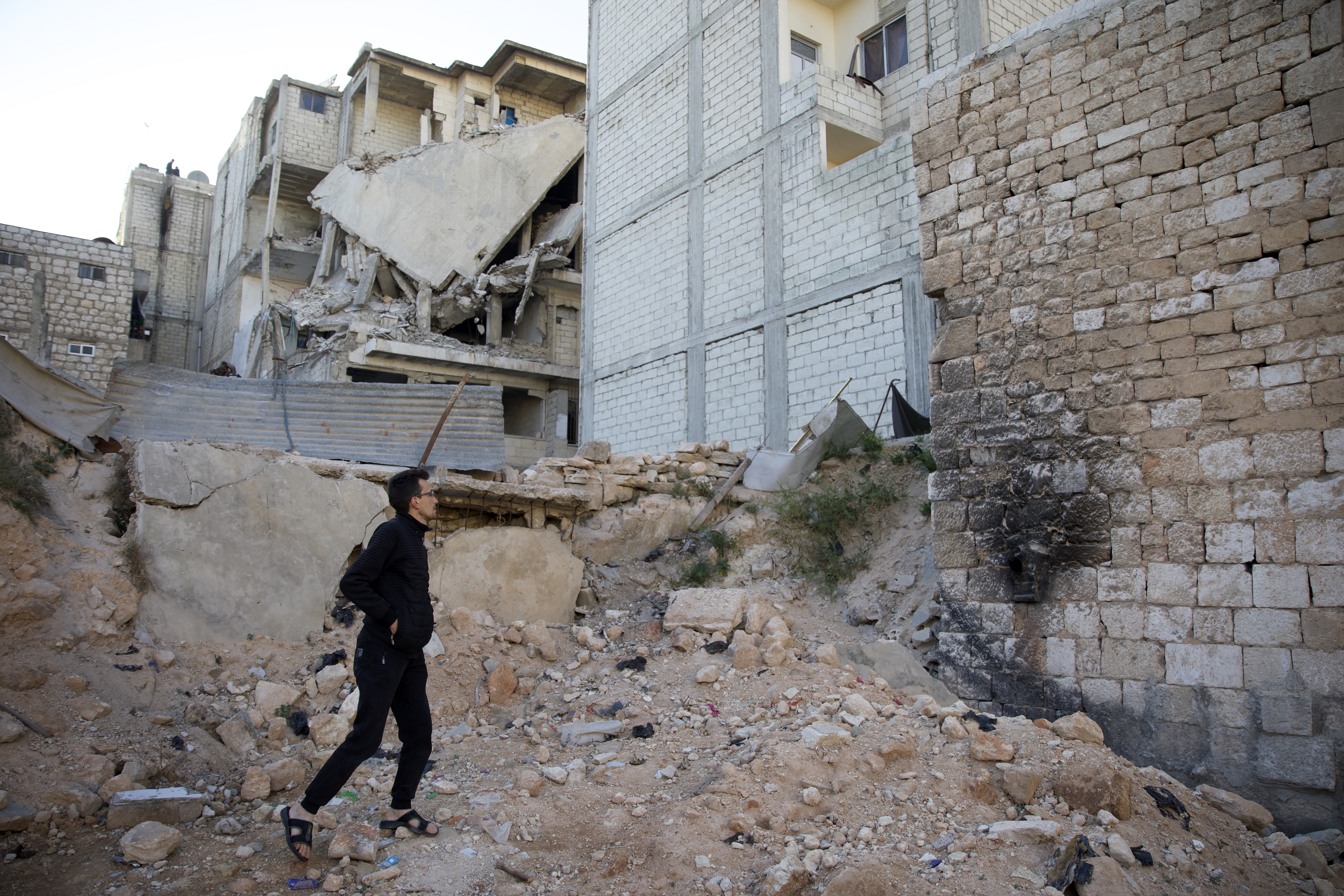 Man walks in rubble of earthquake